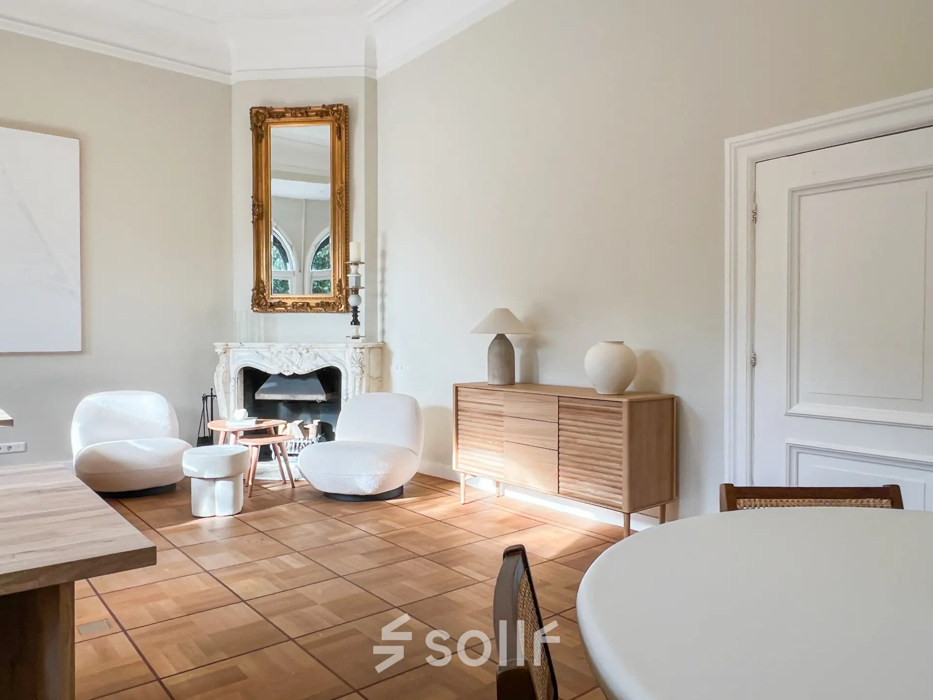 Bright office space with modern furniture and a fireplace, located at Emmalaan 7-9, ideal for office space rental in Amsterdam Old South.