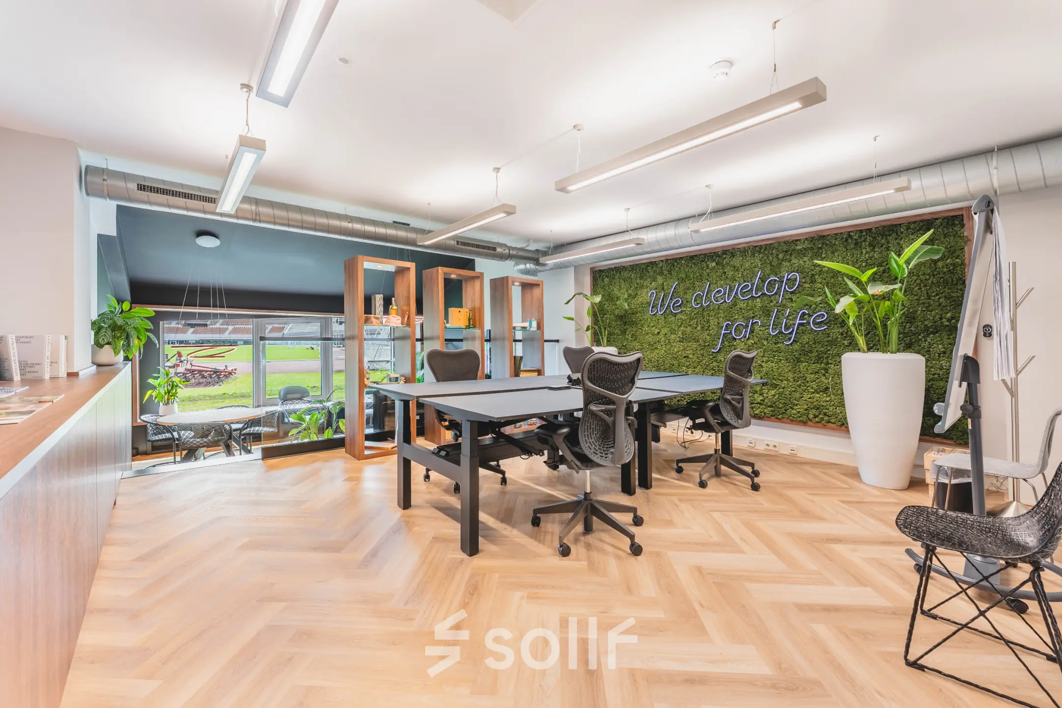 Bright office space with modern furnishings, including desks and ergonomic chairs, located at Olympisch Stadion 24-28, Amsterdam Old South.