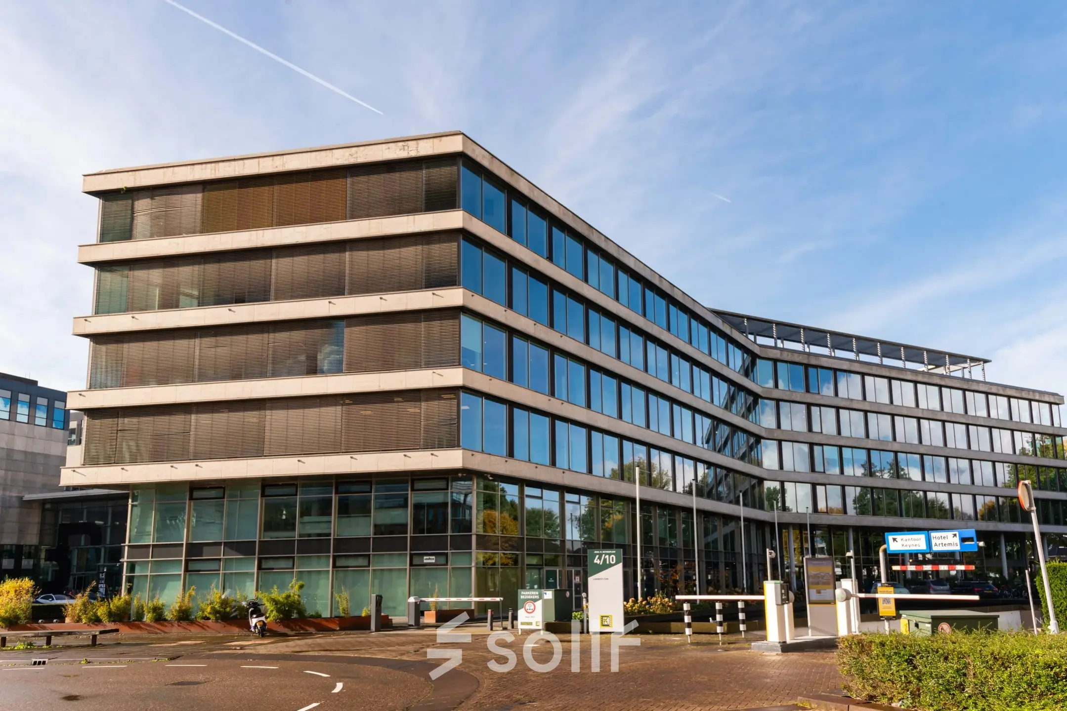 Modern office building exterior at John M. Keynesplein 4-10, Amsterdam Riekerpolder, suitable for office space rental.