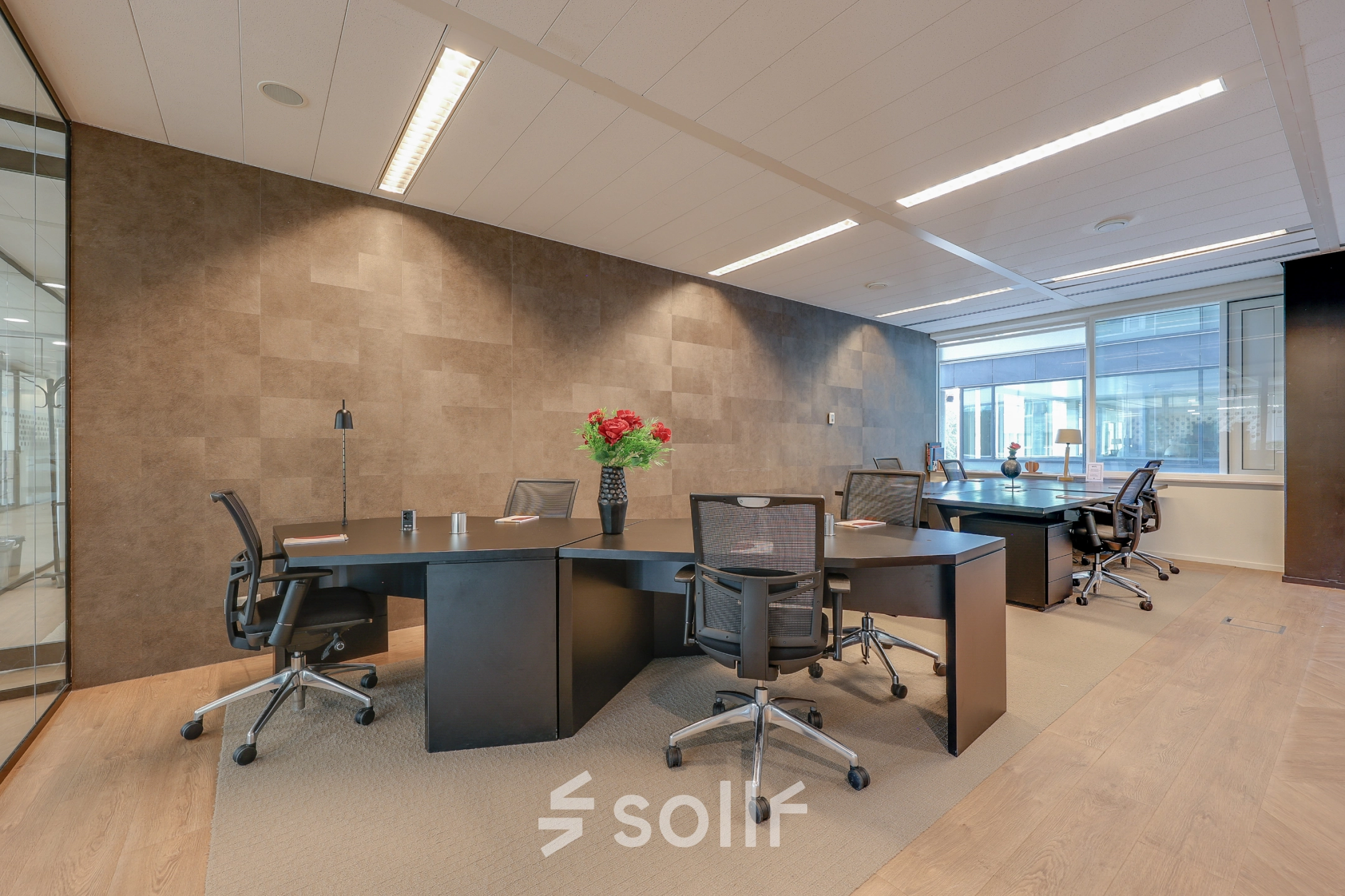 Modern office space rental in Amsterdam Riekerpolder with sleek furnishings, featuring stylish desks, ergonomic chairs, and bright lighting, creating a productive atmosphere. Convenient office to rent at Thomas R. Malthusstraat 1-3.