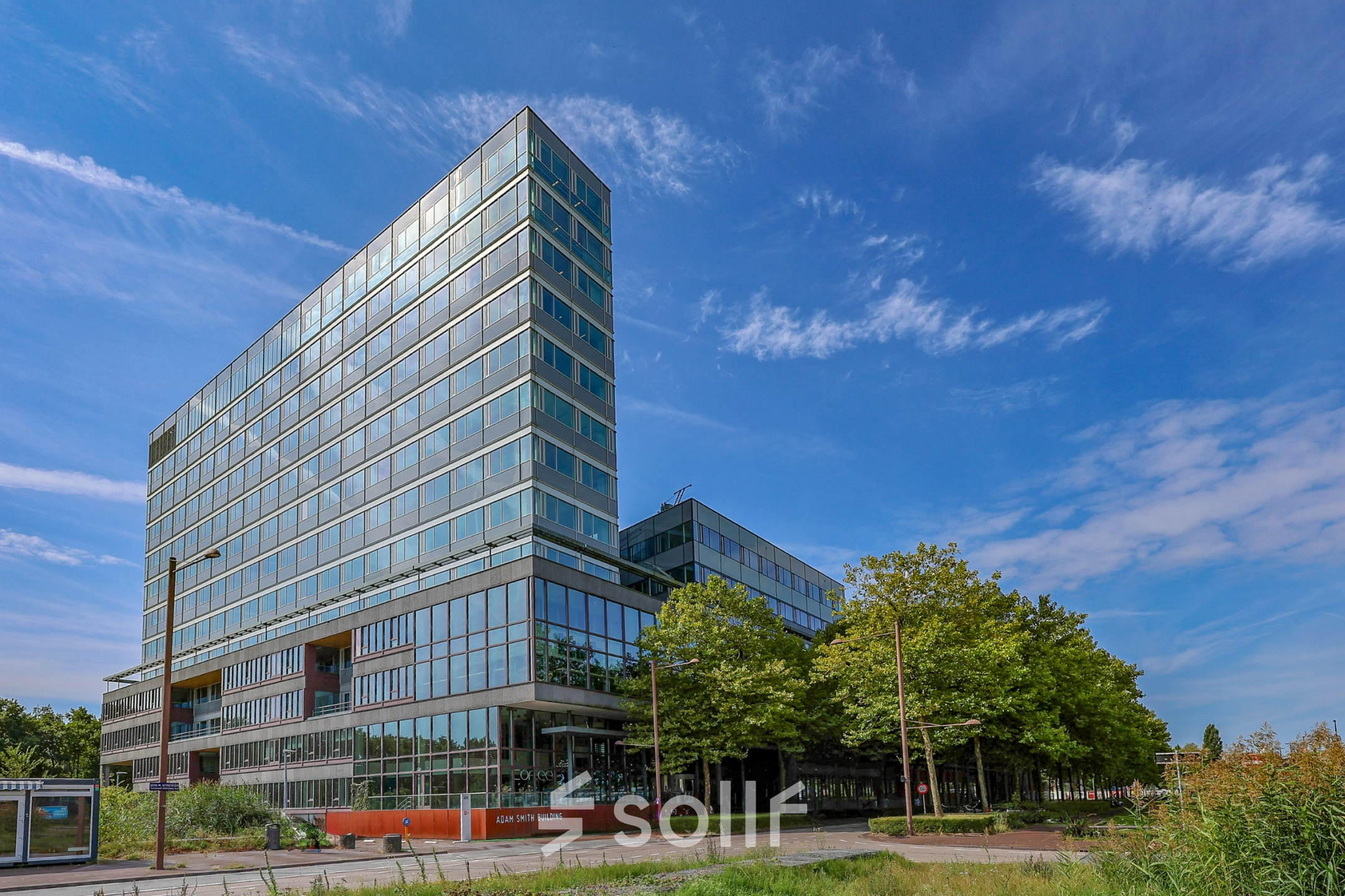 Exterior view of office building at Thomas R. Malthusstraat 1-3, Amsterdam Riekerpolder, ideal for those looking to rent office space.
