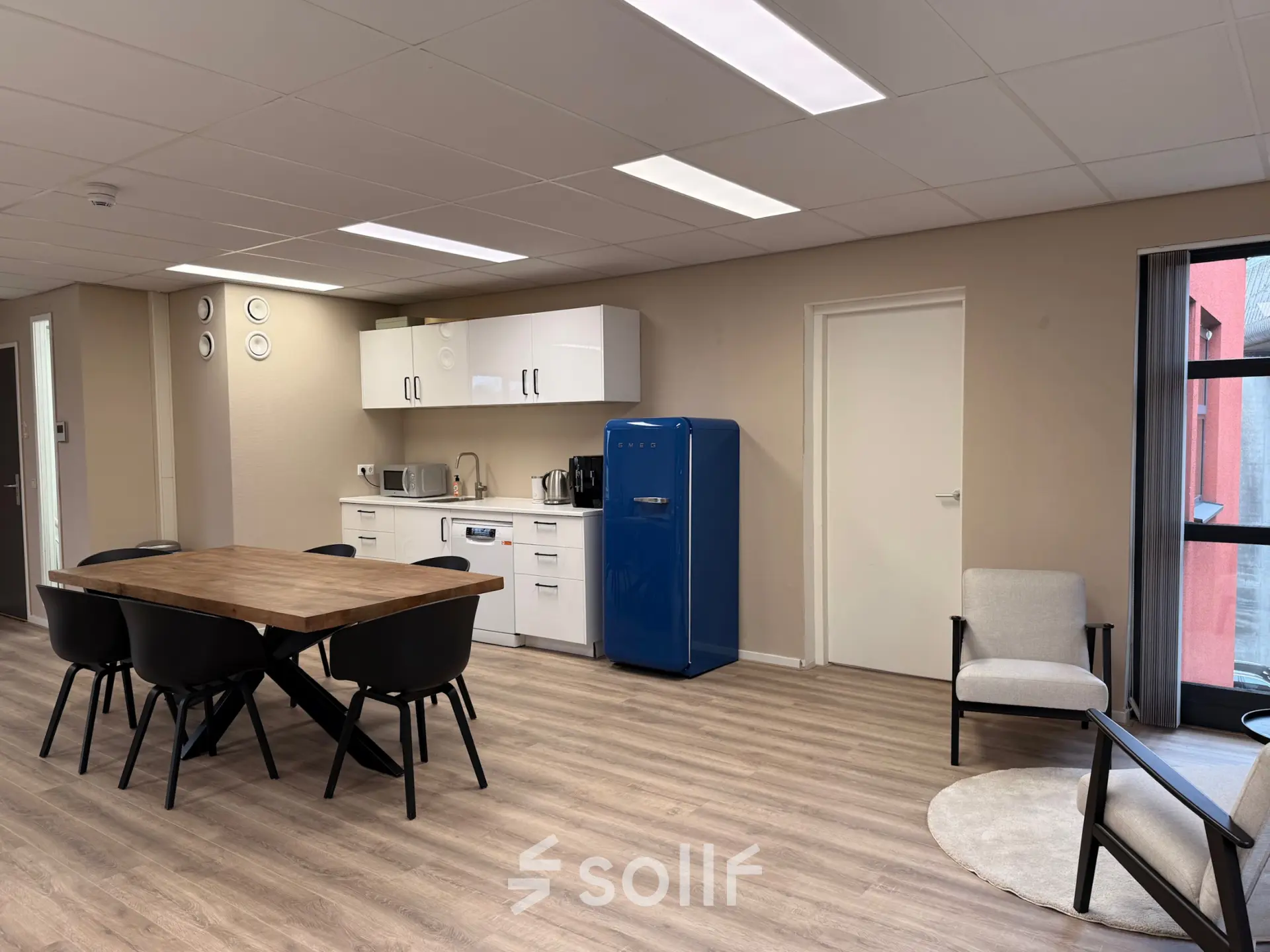 Well-lit office space with a modern dining area and kitchenette at Arlandaweg 92, ideal for an office space rental in Amsterdam Sloterdijk.