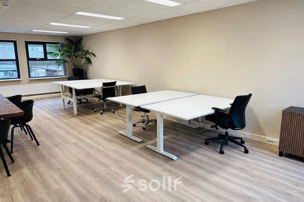 Bright office space at Arlandaweg 92, Amsterdam Sloterdijk, featuring multiple desks and chairs, ideal for office space rental.
