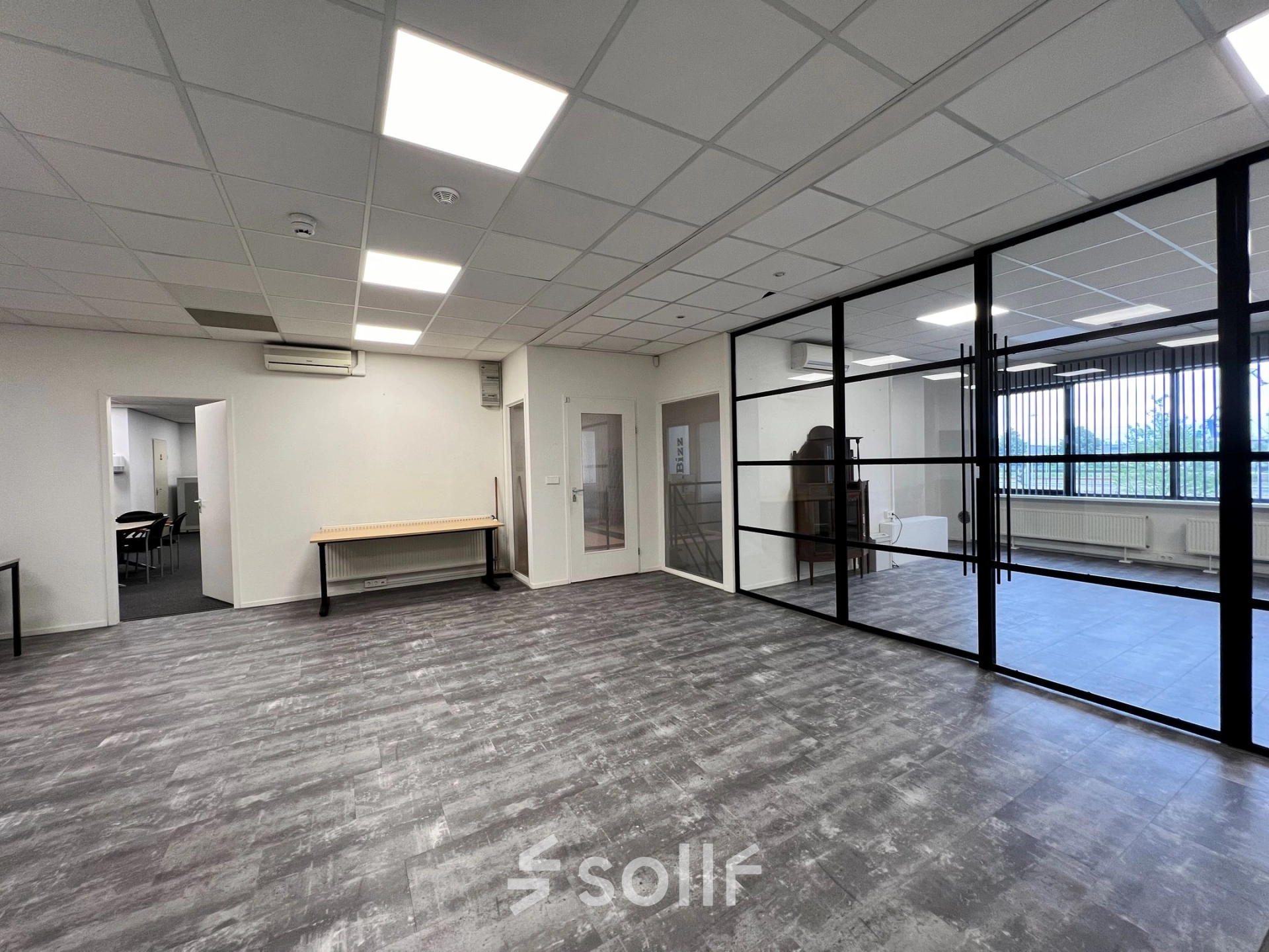 Unfurnished office space for rent at Contactweg 131, Amsterdam Sloterdijk, featuring glass partitions and modern flooring with potential for versatile office space rental.