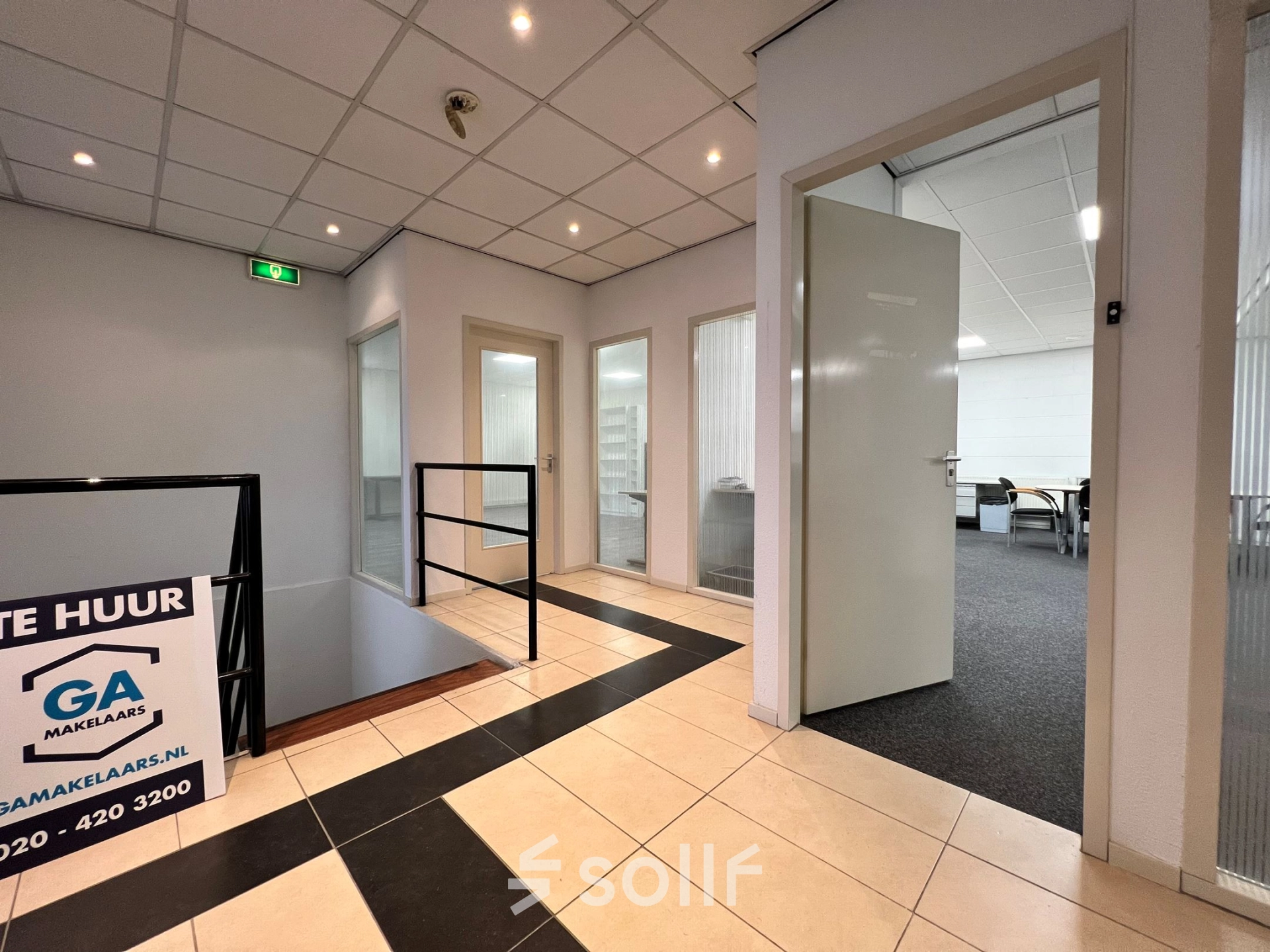 Interior view of office space available for rent at Contactweg 131 in Amsterdam Sloterdijk, featuring multiple open doors and tiled flooring.