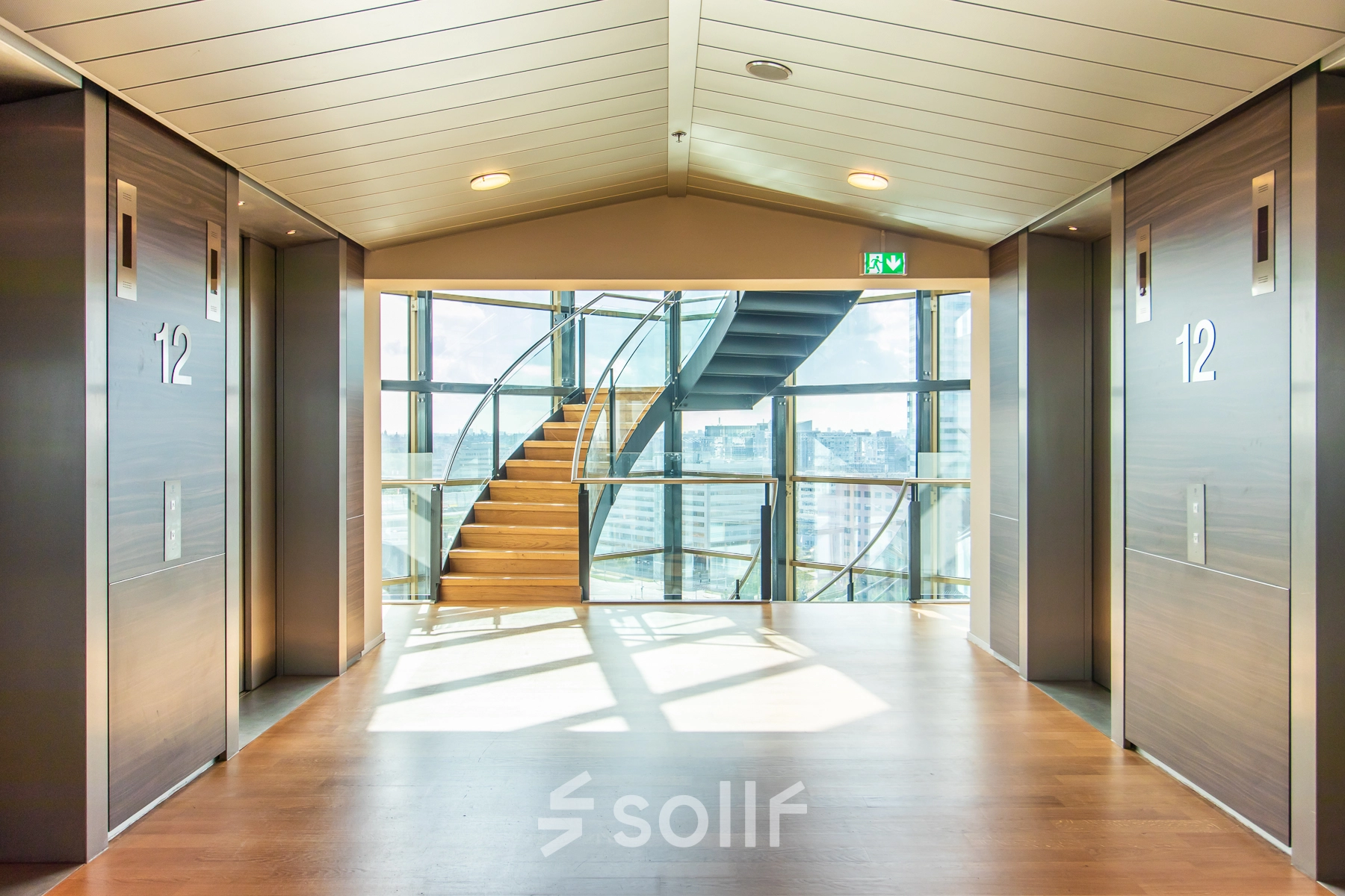 Bright foyer area with a staircase and an expansive view, located at Radarweg 29, Amsterdam Sloterdijk, ideal for office space rental.