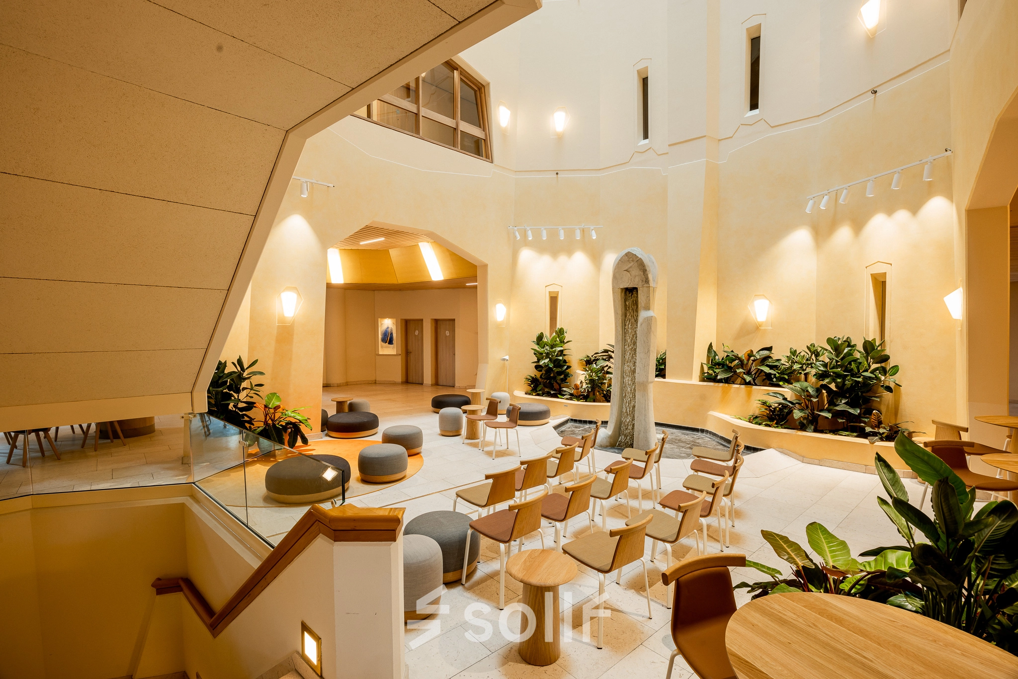 Spacious office interior at Bijlmerplein 888, Amsterdam South East, featuring modern seating arrangements and vibrant natural light, perfect for office space rental.