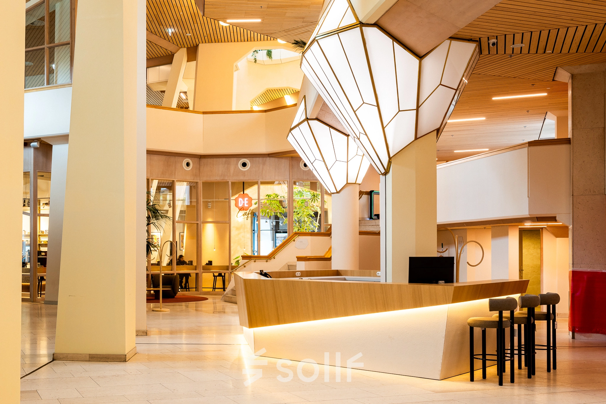 Modern office to rent featuring a stylish reception area with sleek lighting and contemporary design at Bijlmerplein 888, Amsterdam South East.