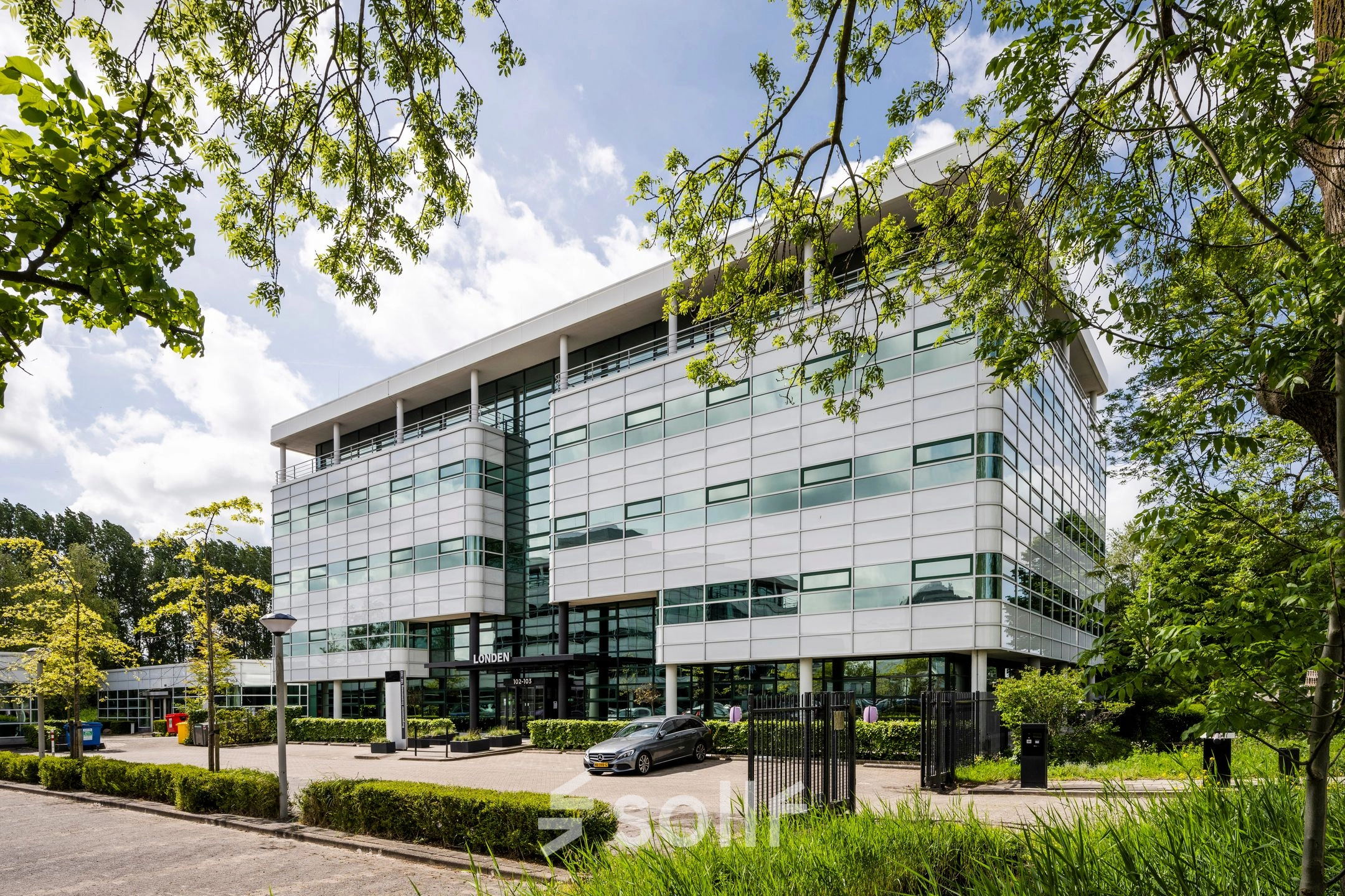 Exterior view of a modern office building located at Burgemeester Stramanweg 102, Amsterdam South East, ideal for office space rental.