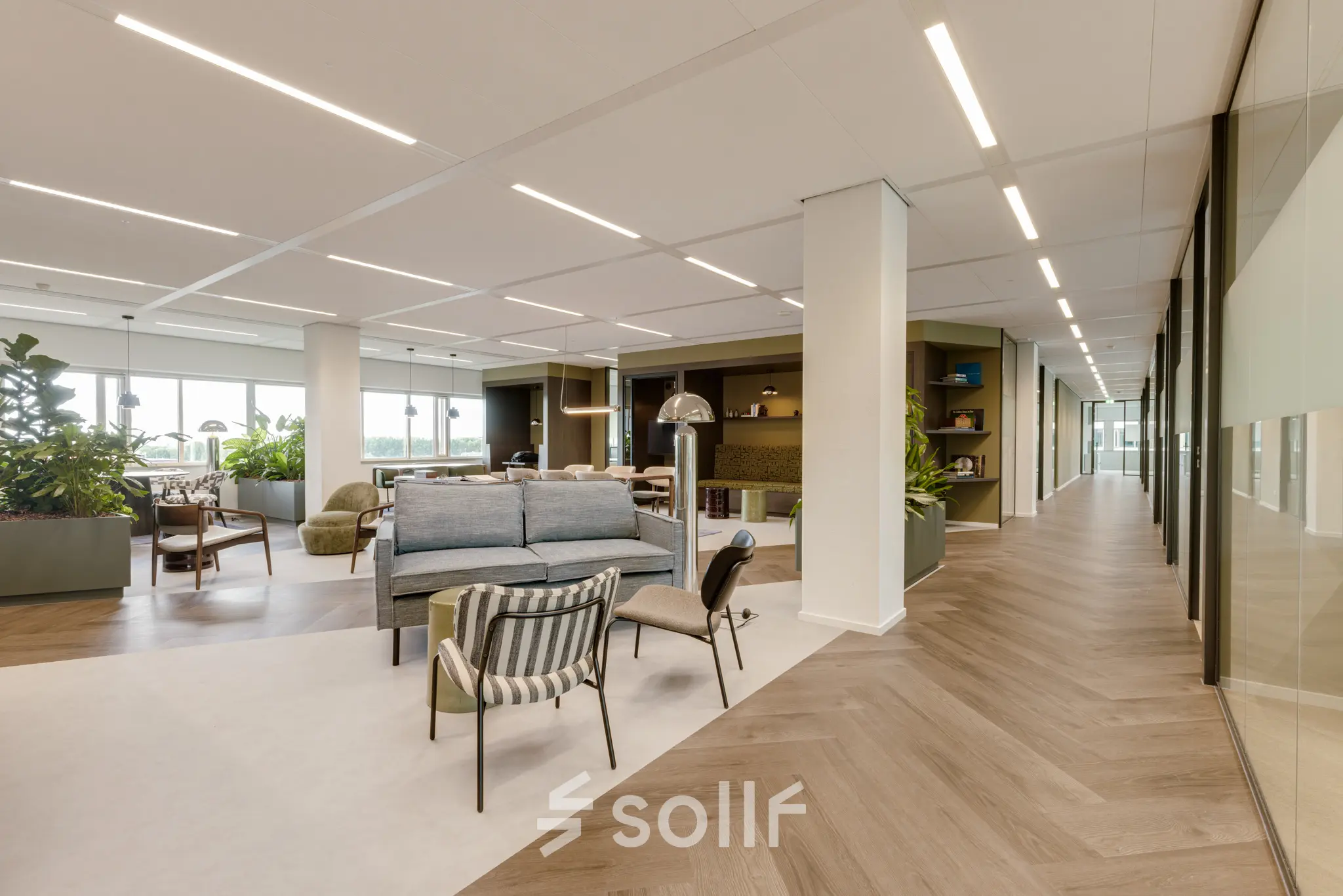 Spacious office at Herikerbergweg 288, Amsterdam South East, featuring modern furnishings and hardwood flooring; a perfect office space rental with open floorplan for workspaces.