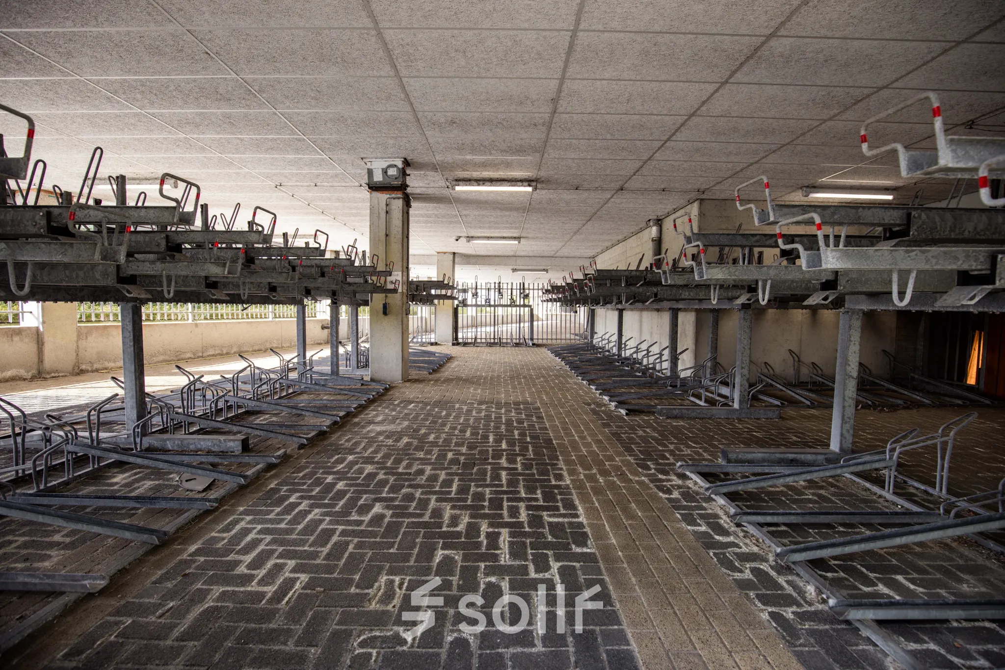 Spacious bike parking area at Herikerbergweg 288, Amsterdam South East, ideal for those seeking office space rental with convenient cycling access.