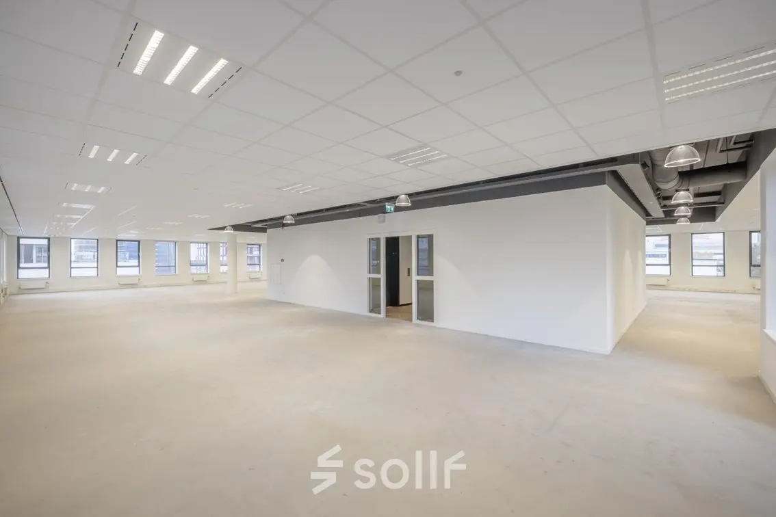 Bright and spacious office to rent at Hogehilweg 24, featuring an open floorplan with ample windows for natural light in Amsterdam South East.