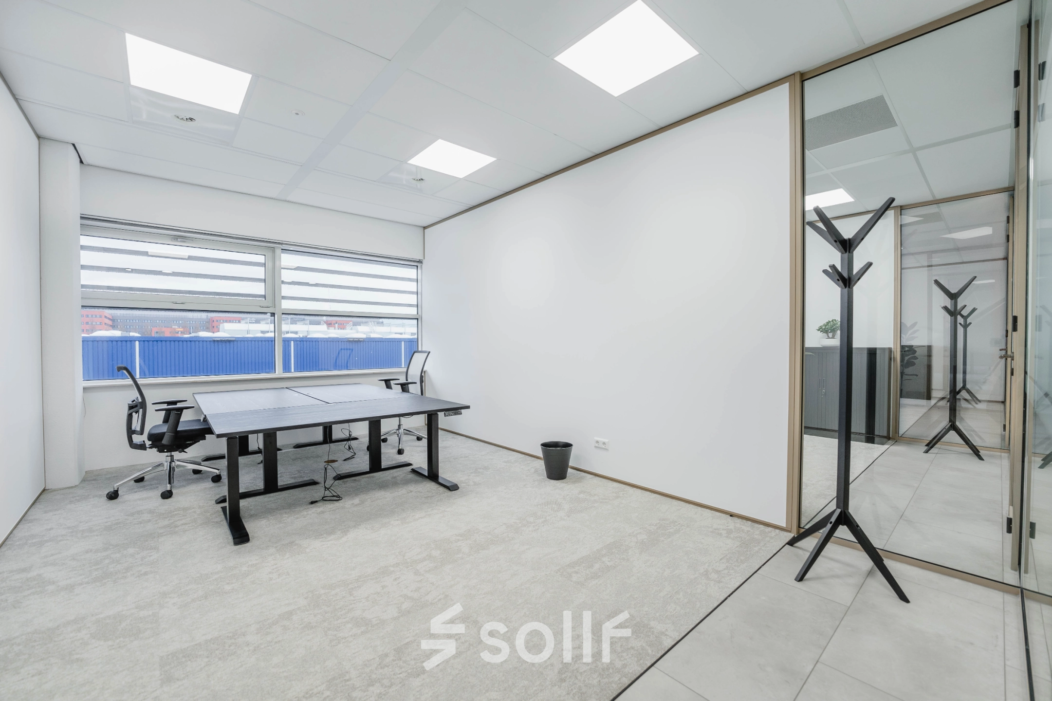Bright office space interior with desks and chairs, perfect for those seeking office space rental in Amsterdam South East.