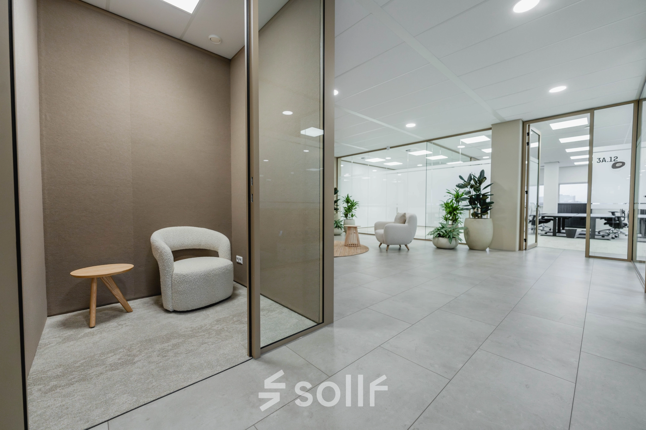 Modern office space at Laarderhoogtweg 7-19, Amsterdam South East featuring a seating area and plants, perfect for office space rental.