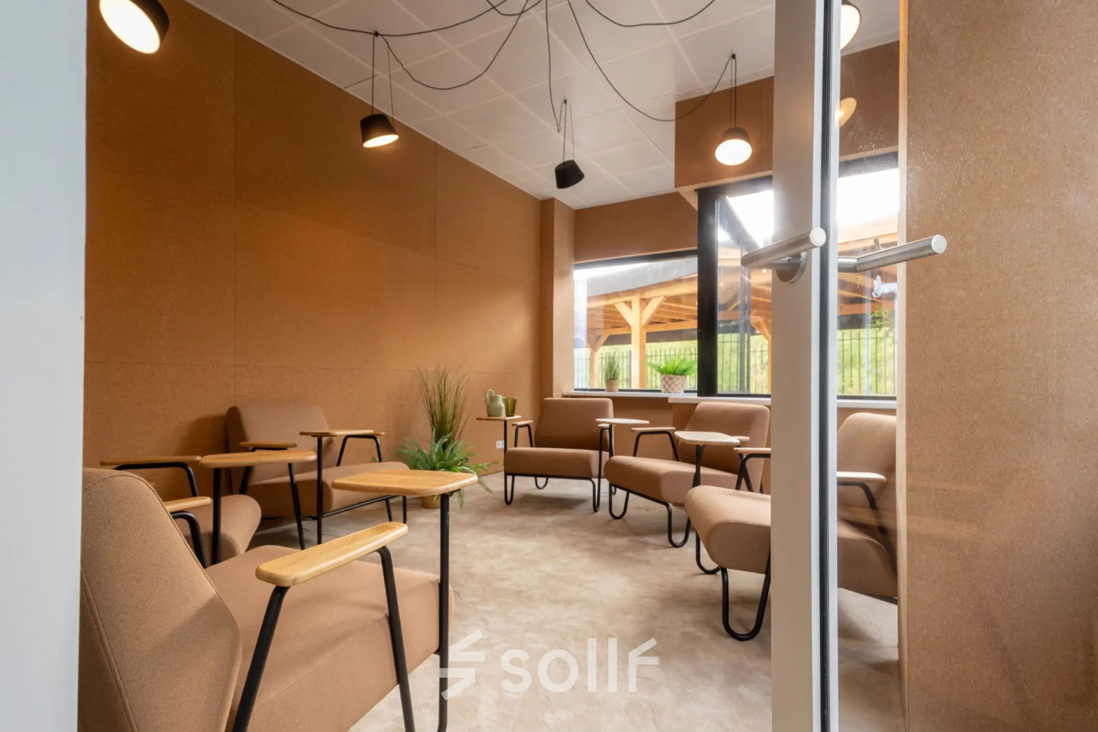 Cozy office space with modern furnishings at Luttenbergweg 8, Amsterdam South East, available for rent. Comfortable seating and natural lighting create a welcoming environment.
