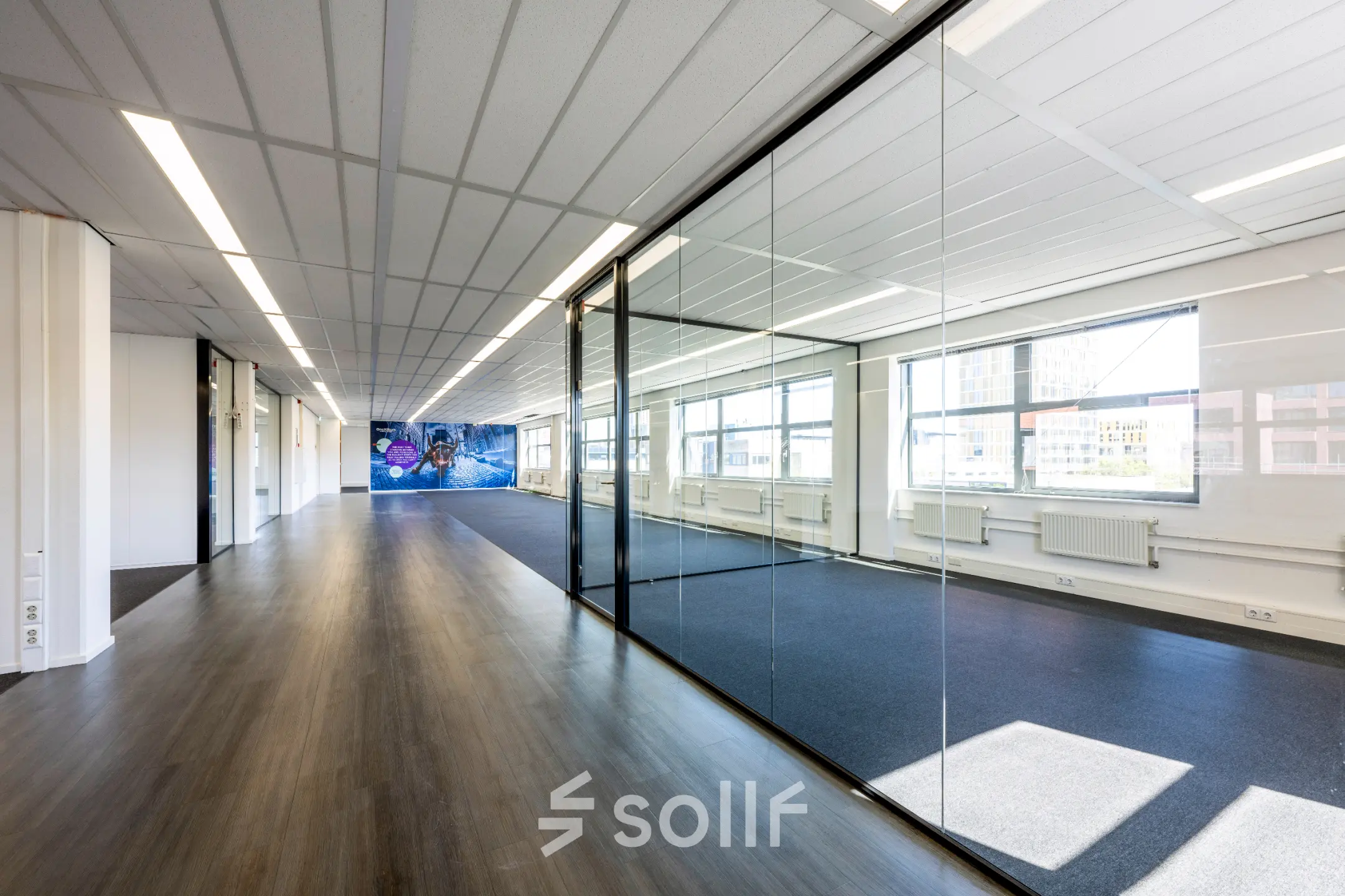 Office space for rent at Paasheuvelweg 20 20 in Amsterdam South East, featuring spacious interiors with large windows and glass walls.