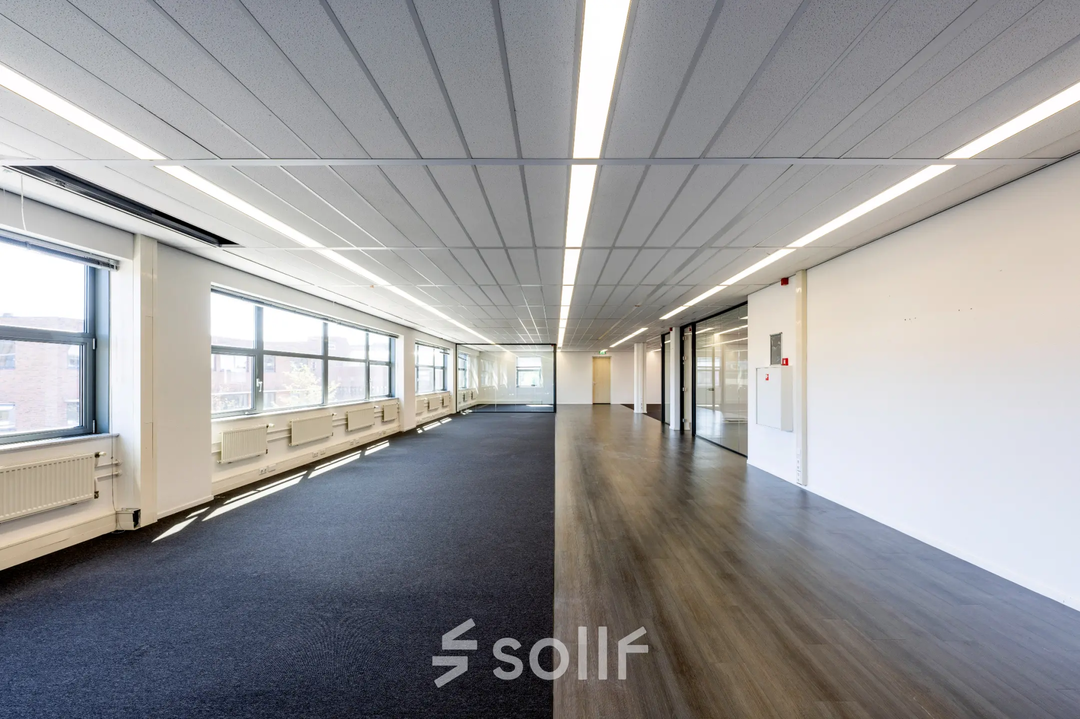 Spacious office space for rent at Paasheuvelweg 20 20, Amsterdam South East, featuring large windows and ample natural light.