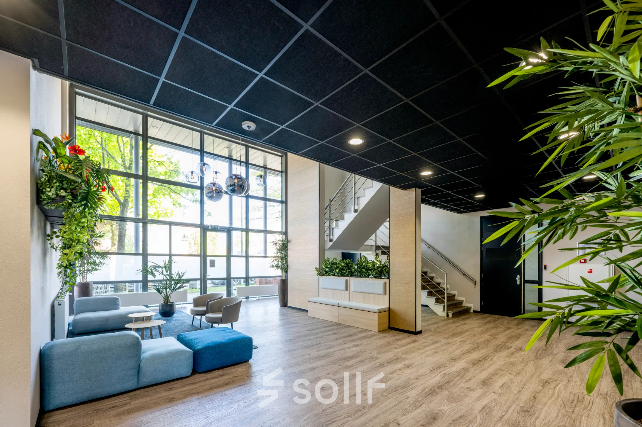 Modern office space with ample natural light and seating area at Paasheuvelweg 20 20, Amsterdam South East, ideal for office space rental.