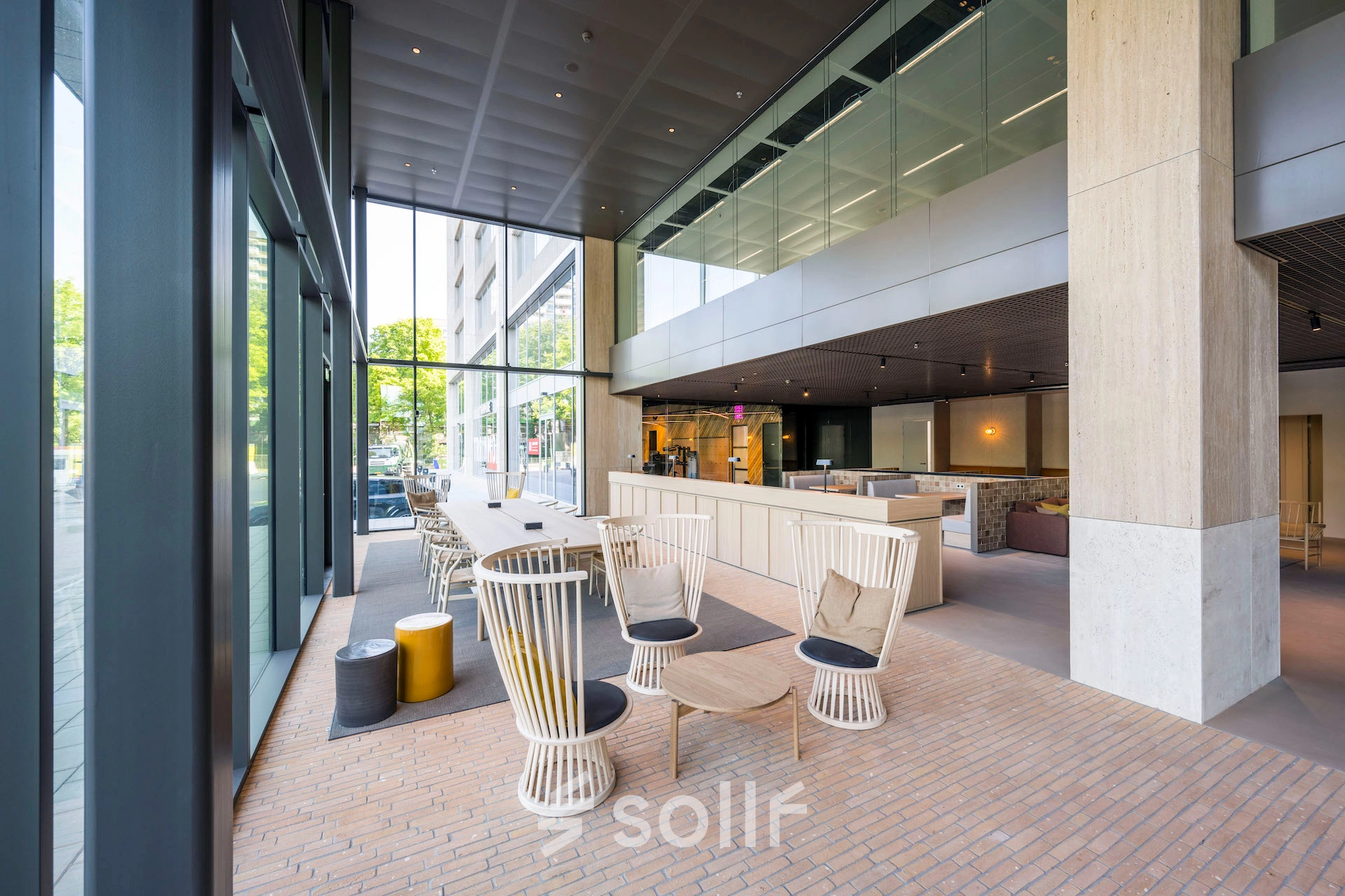 Spacious office to rent in Amsterdam West with modern furnishings, featuring high ceilings and large windows at Nachtwachtlaan 20. Ideal for anyone seeking office space rental with ample natural light.