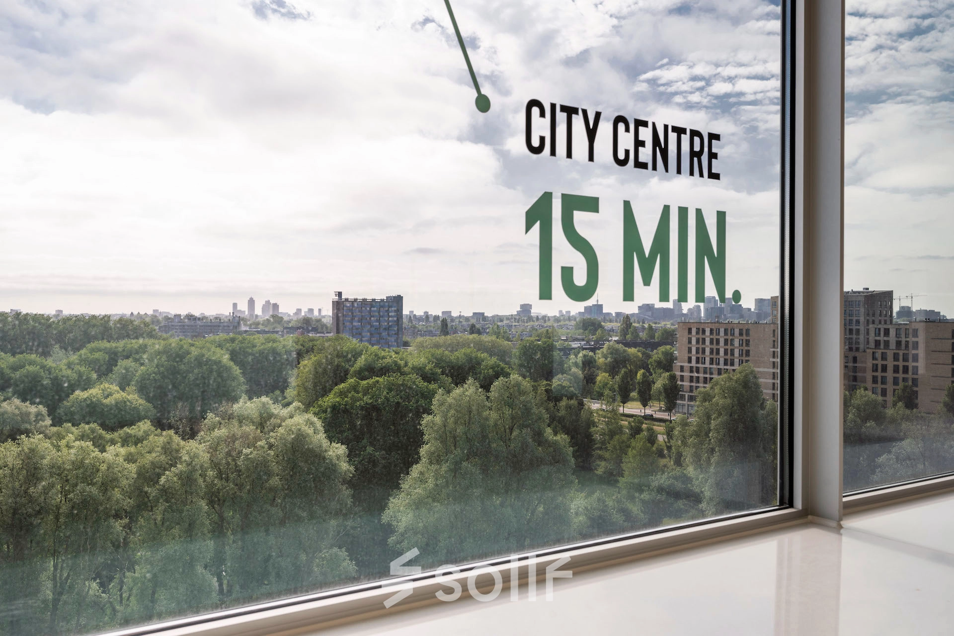 Scenic city view from an office window at Nachtwachtlaan 20 with city center 15 minutes away.
