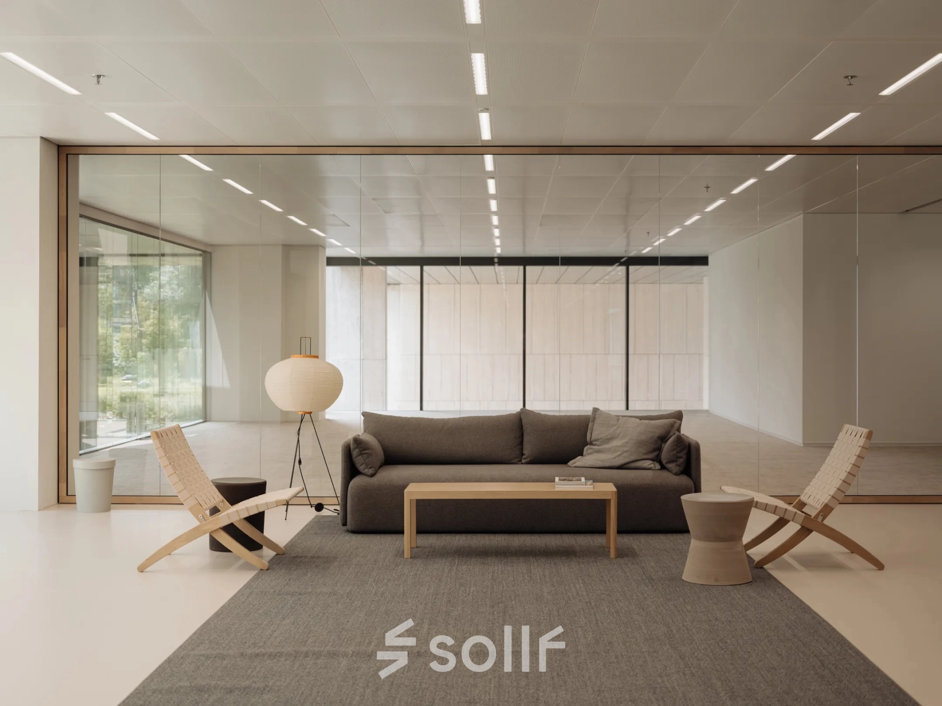 Modern office to rent featuring a cozy seating area with a sofa and chairs, ideal for meetings. Located in Amsterdam West, offering excellent office space rental opportunities.