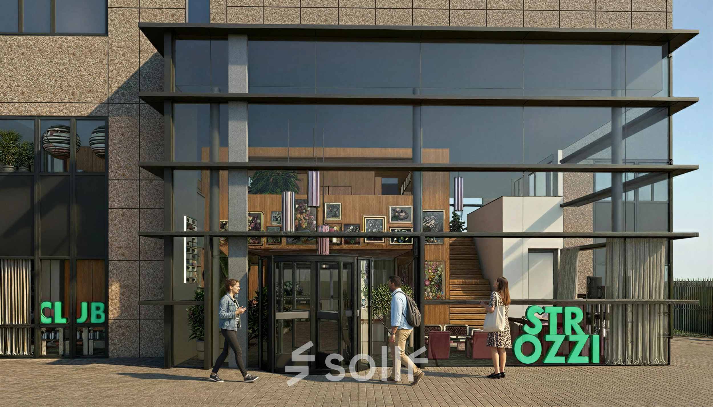 Exterior view of an office to rent at Barbara Strozzilaan 101 101, Amsterdam Zuidas, featuring glass facade and main entrance where people are entering the building.