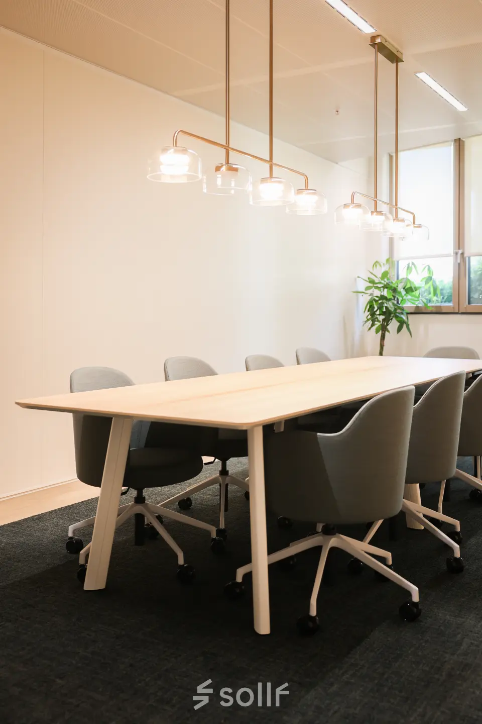 Modern conference room at Beethovenstraat 503, Amsterdam Zuidas, featuring a large table and comfortable chairs, ideal for office space rental.