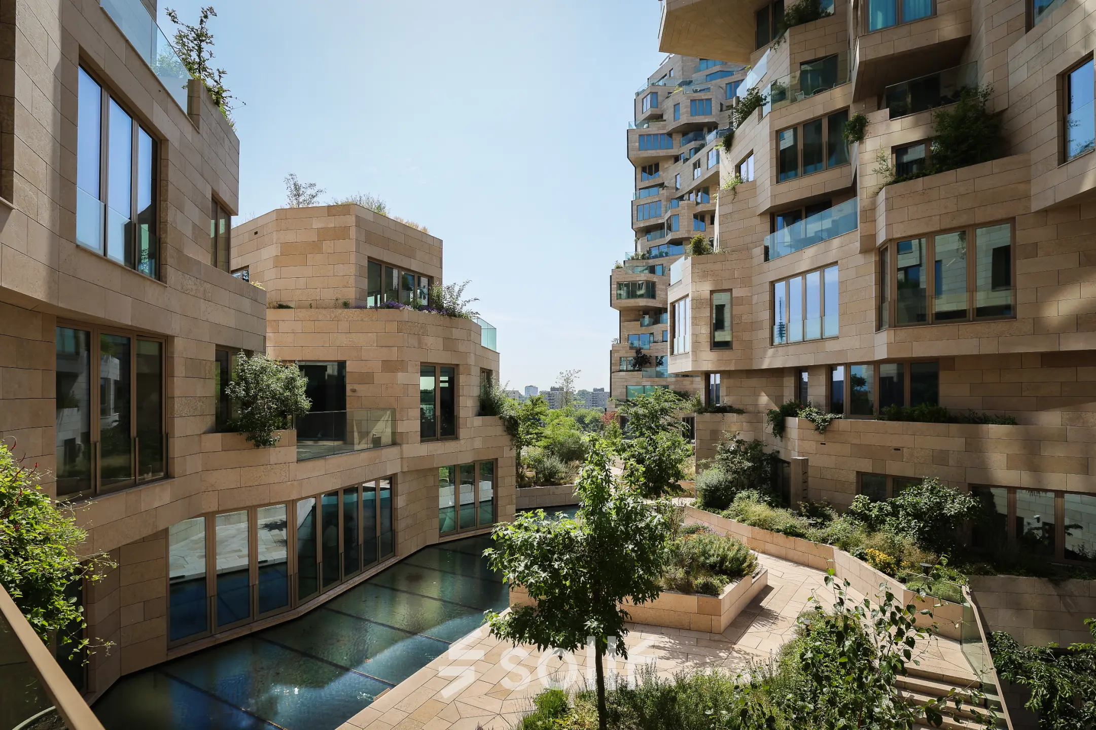 Exterior view of the office building at Beethovenstraat 503, Amsterdam Zuidas, featuring modern architecture and garden areas, ideal for those seeking office space rental.