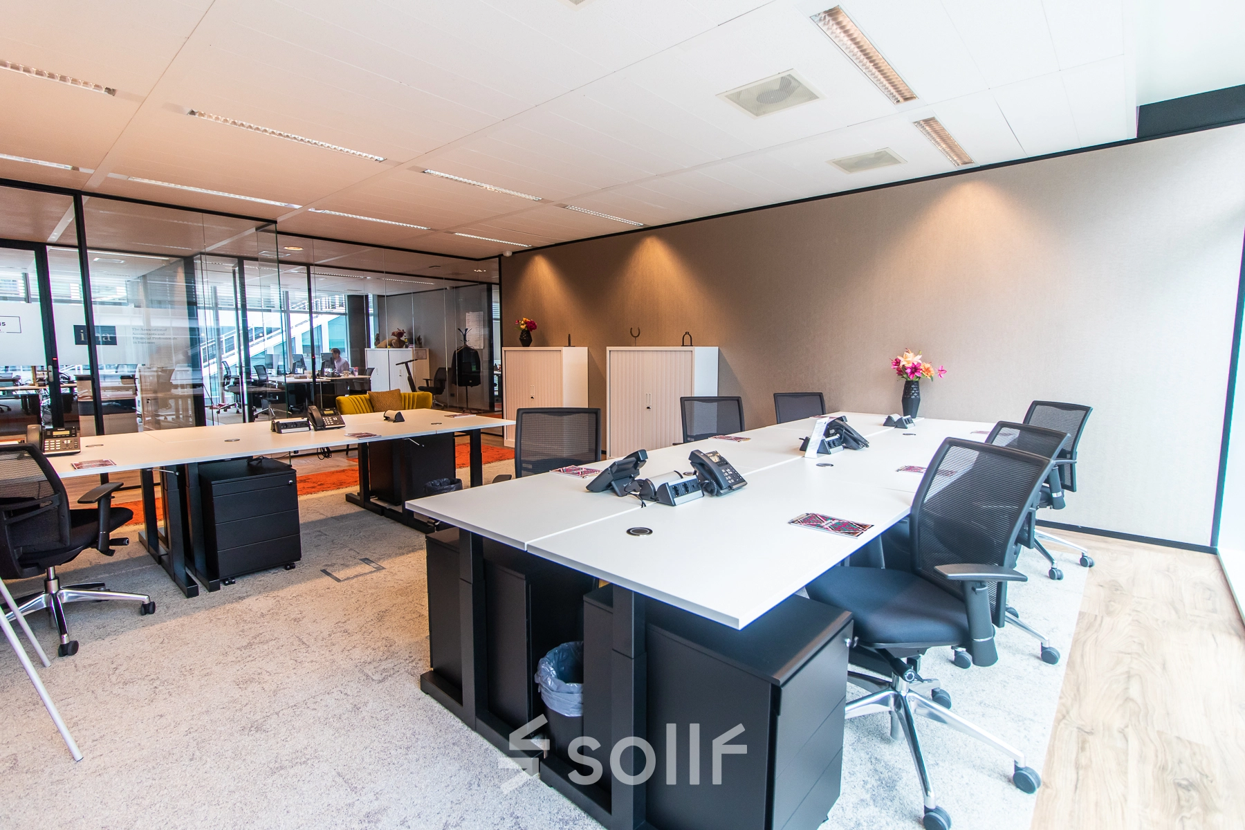 Modern furnished office space at Claude Debussylaan 7-29 in Amsterdam Zuidas, featuring sleek desks and chairs ready for office space rental.