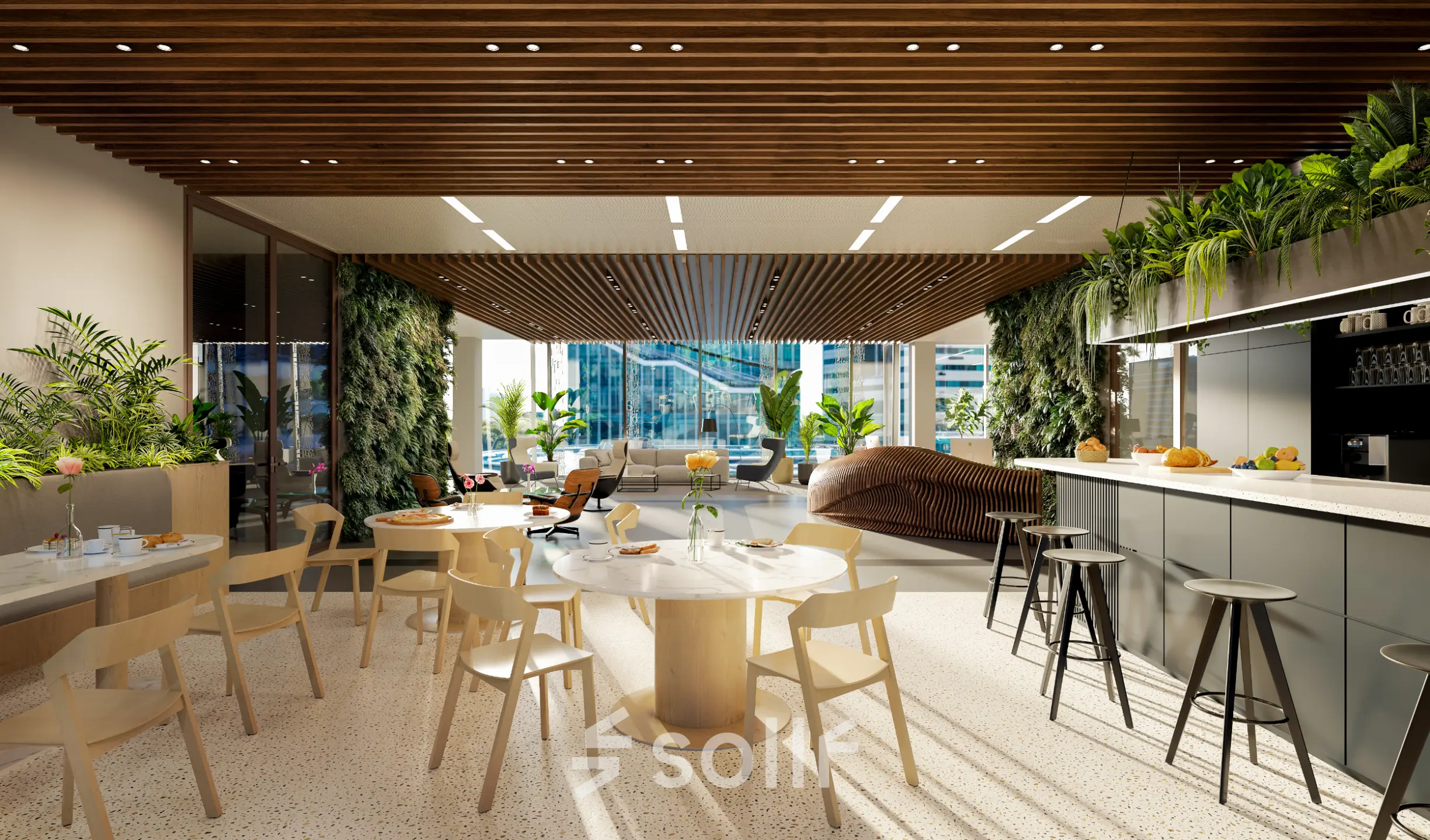 Modern office space in Amsterdam Zuidas with a stylish lounge area, featuring marble tables, wooden chairs, and indoor plants ideal for office space rental.