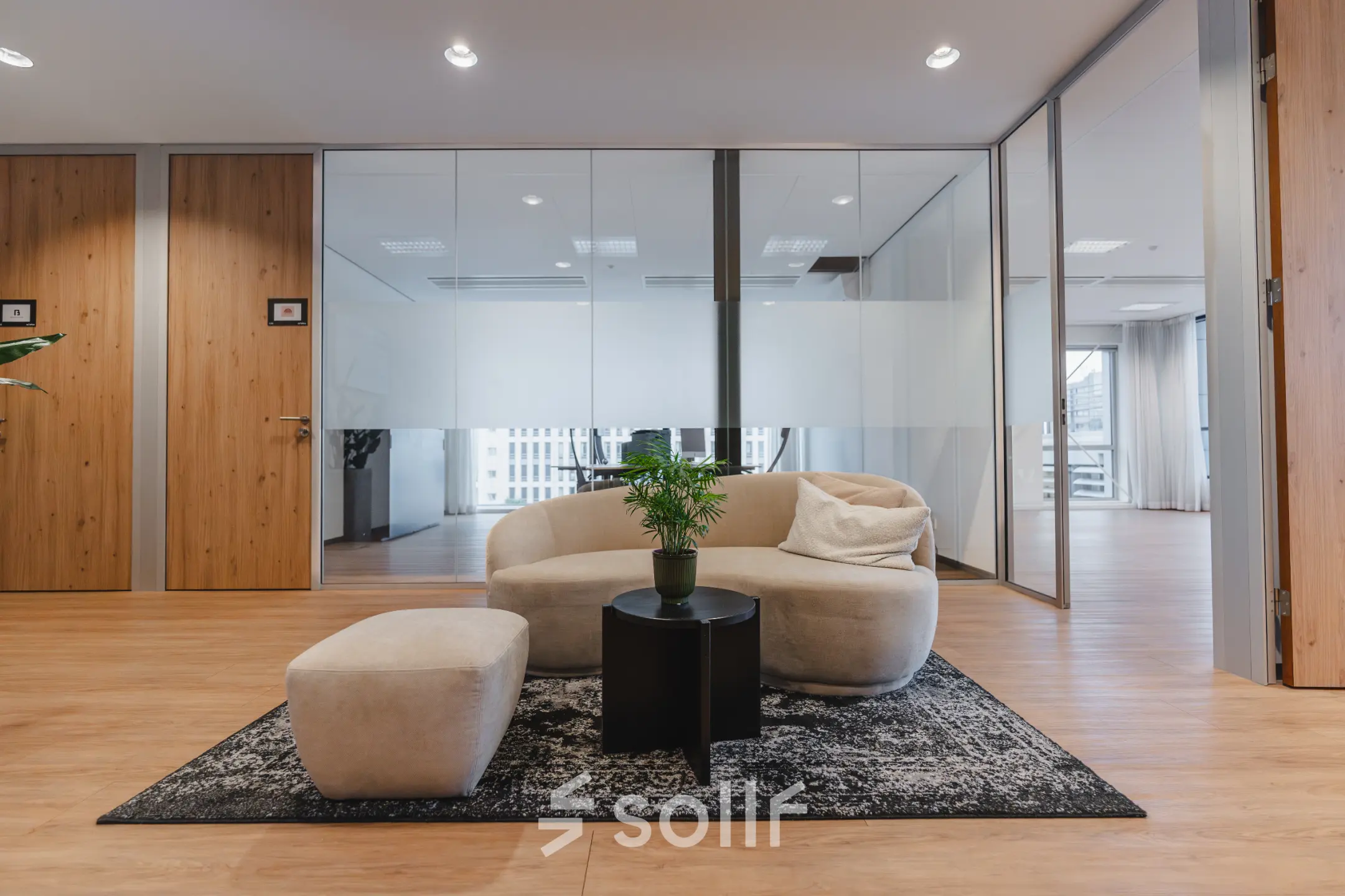 Furnished office interior at De Boelelaan 30, Amsterdam Zuidas, featuring modern seating and table. Ideal for office space rental.