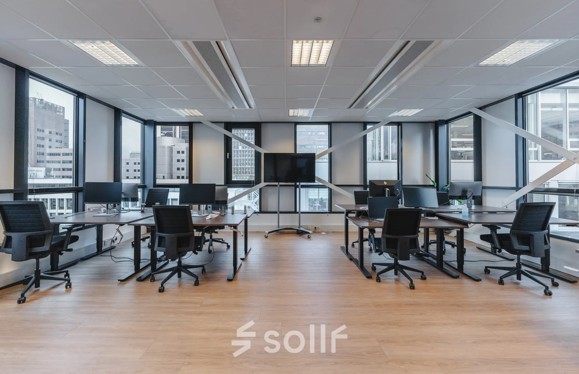 Spacious office interior at De Boelelaan 30, Amsterdam Zuidas, featuring multiple desks and chairs for office space rental.