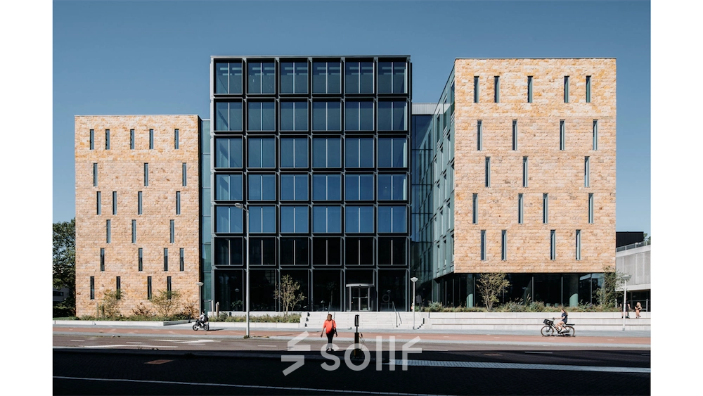 Exterior view of an office building at Fred. Roeskestraat 100, Amsterdam Zuidas, highlighting the modern architectural design suitable for office space rental.