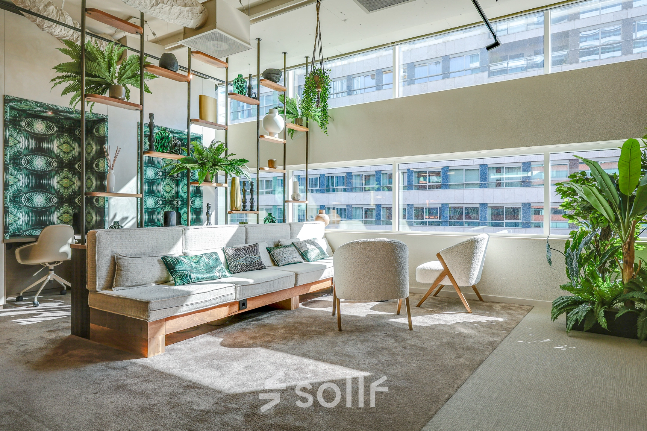 Bright office space for rent at Gustav Mahlerlaan 308, Amsterdam Zuidas, furnished with modern seating and lush greenery, perfect for an inspiring workspace.