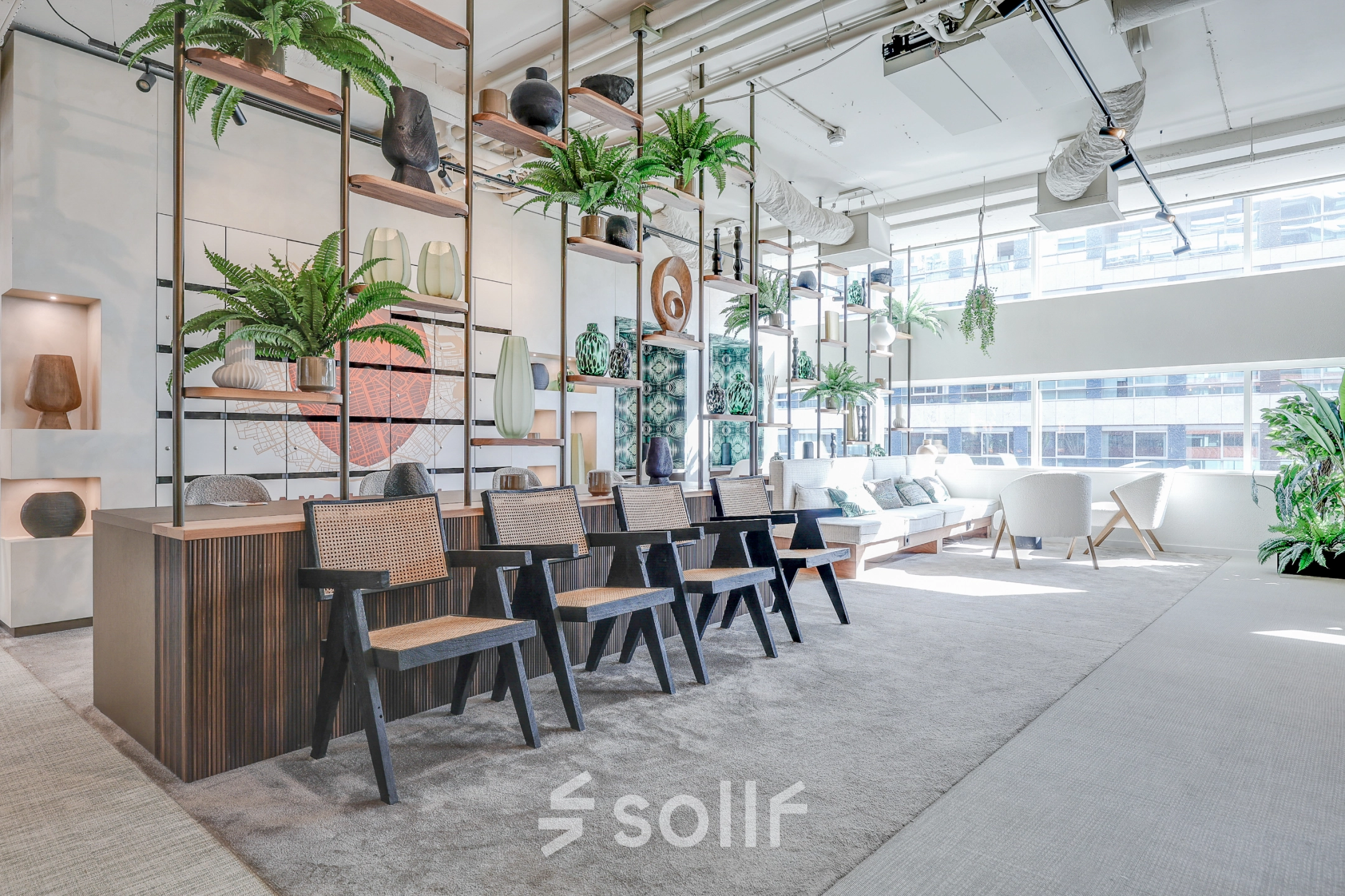 Bright office space to rent at Gustav Mahlerlaan 308 with modern furnishings, plants, and an open lounge area in Amsterdam Zuidas.