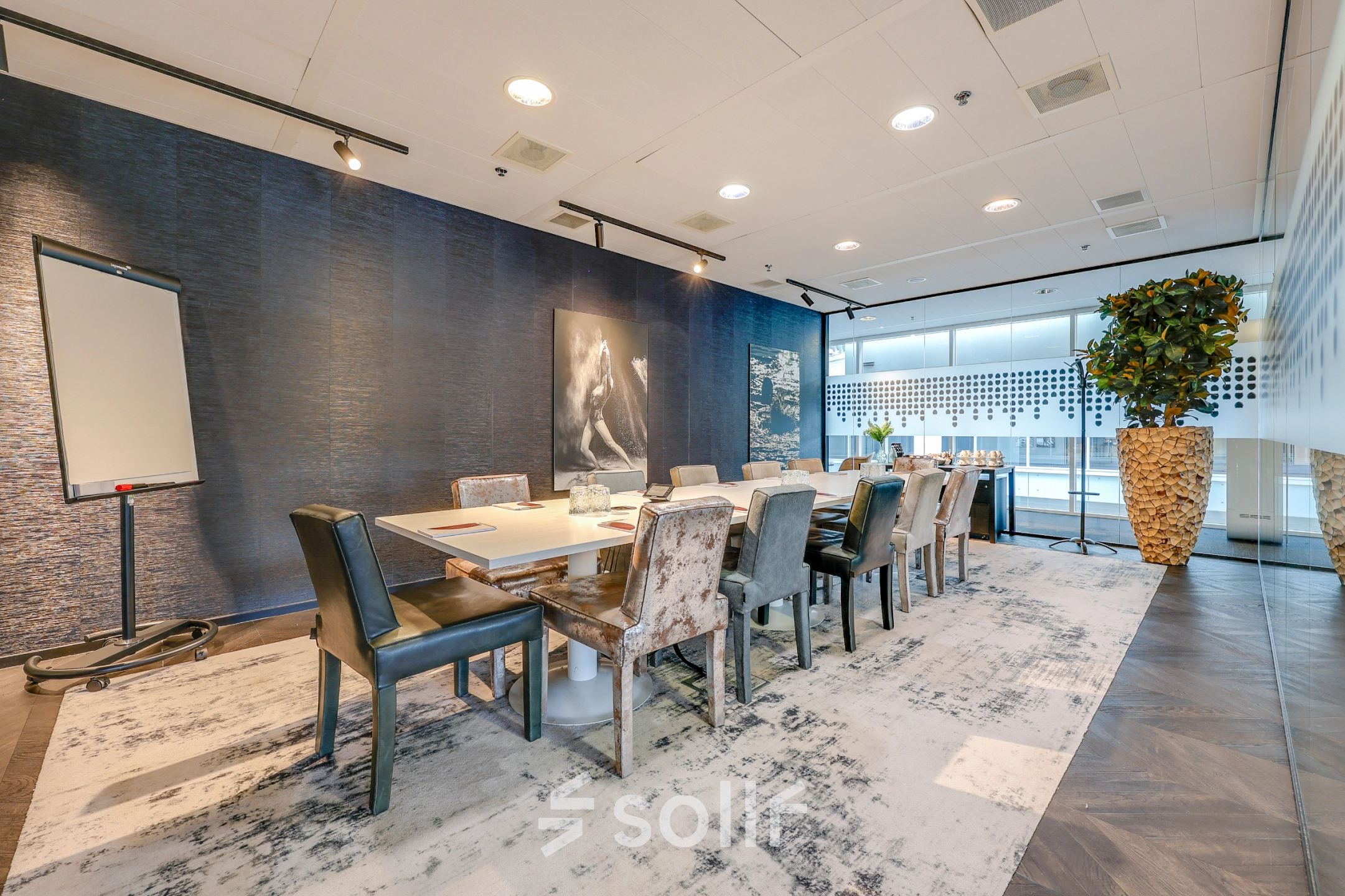 Spacious conference room at Gustav Mahlerplein, Amsterdam Zuidas, perfect for office space rental with elegant decor and ample natural light.