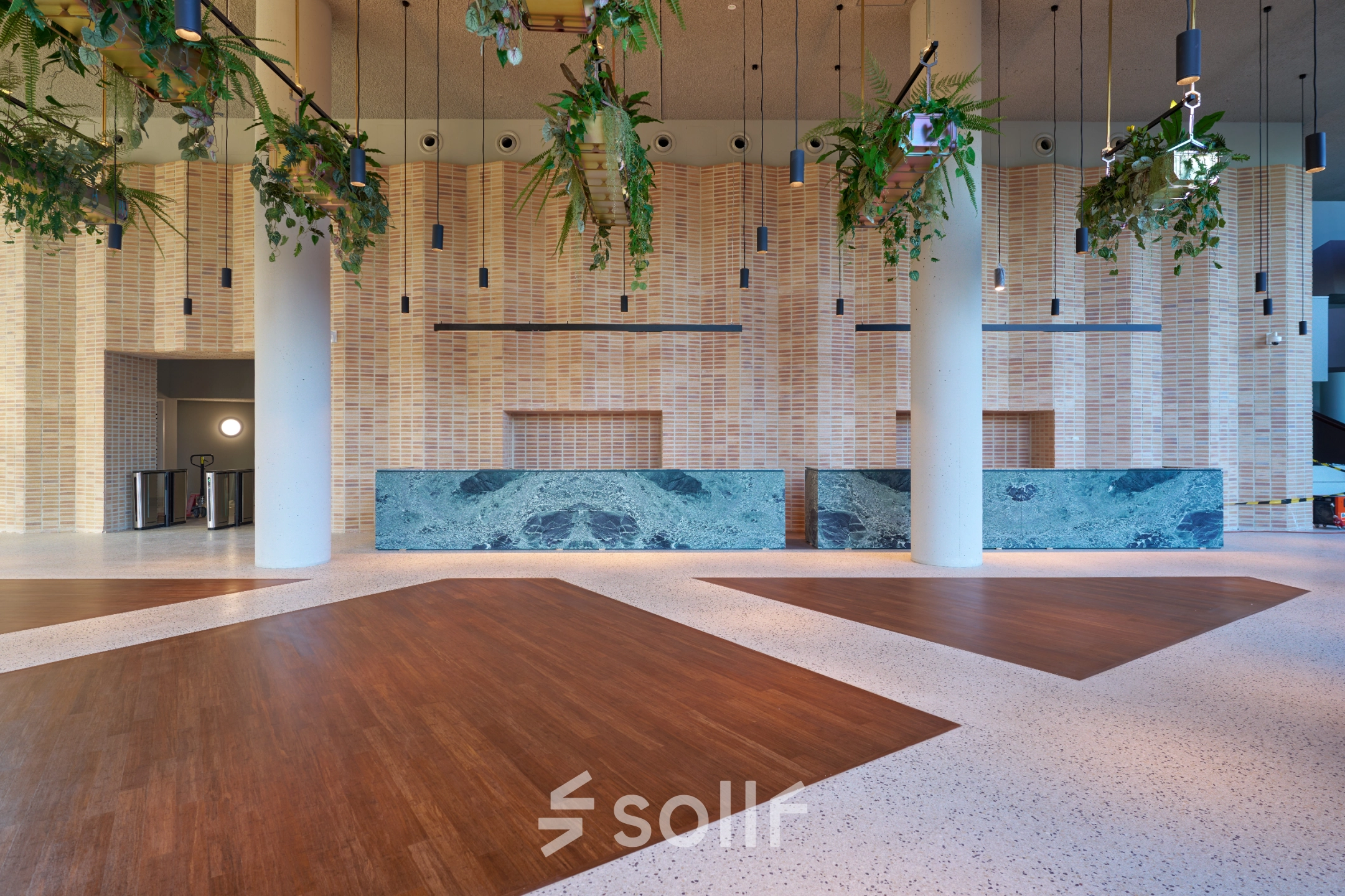 Spacious and elegant entrance at Hildegard Von Bingenstraat 44, Amsterdam Zuidas, ideal for office space rental. Modern design with high ceilings and sleek finishes.