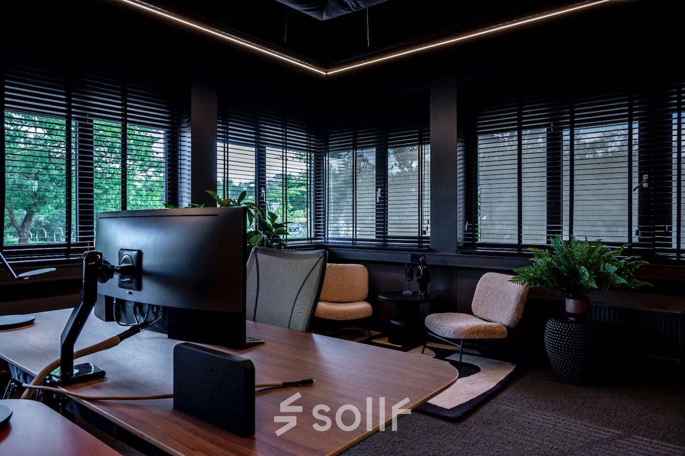 Modern office space at Lange Amerikaweg 55-61, Apeldoorn featuring workstations with computers, comfortable seating, and abundant natural light from large windows, suitable for office space rental.