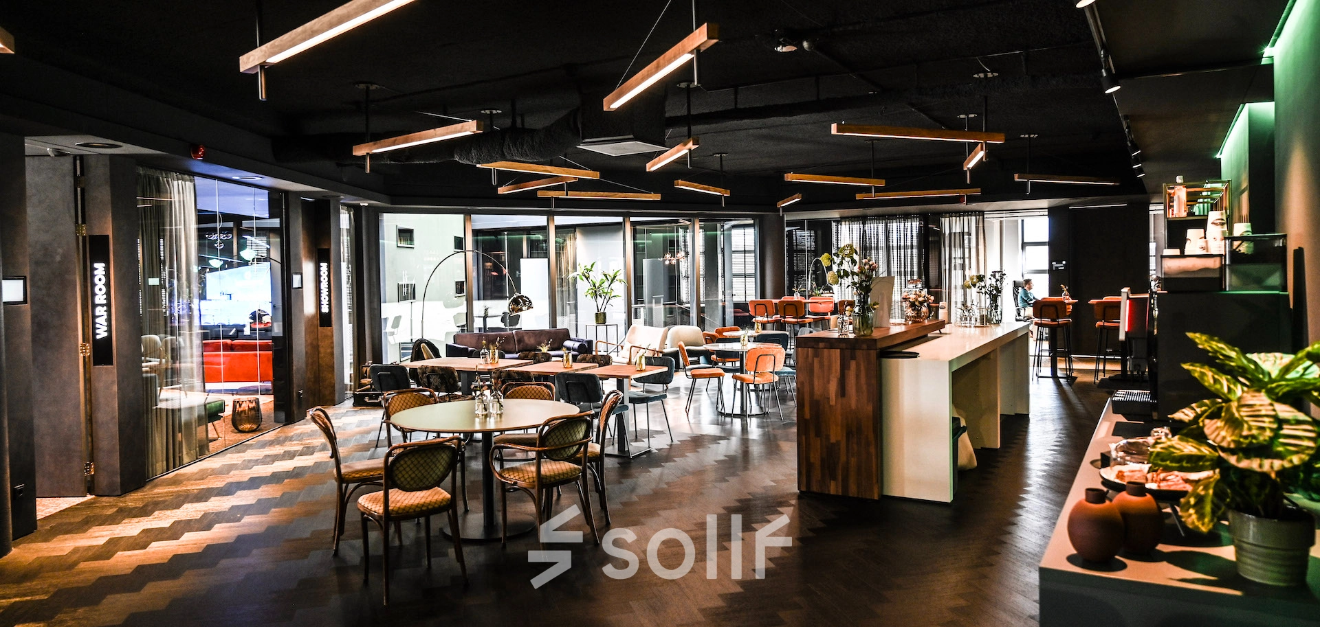 Stylish and modern furnished workspace at Lange Amerikaweg 55-61 Apeldoorn, ideal for office space rental with chic decor and versatile seating arrangements.