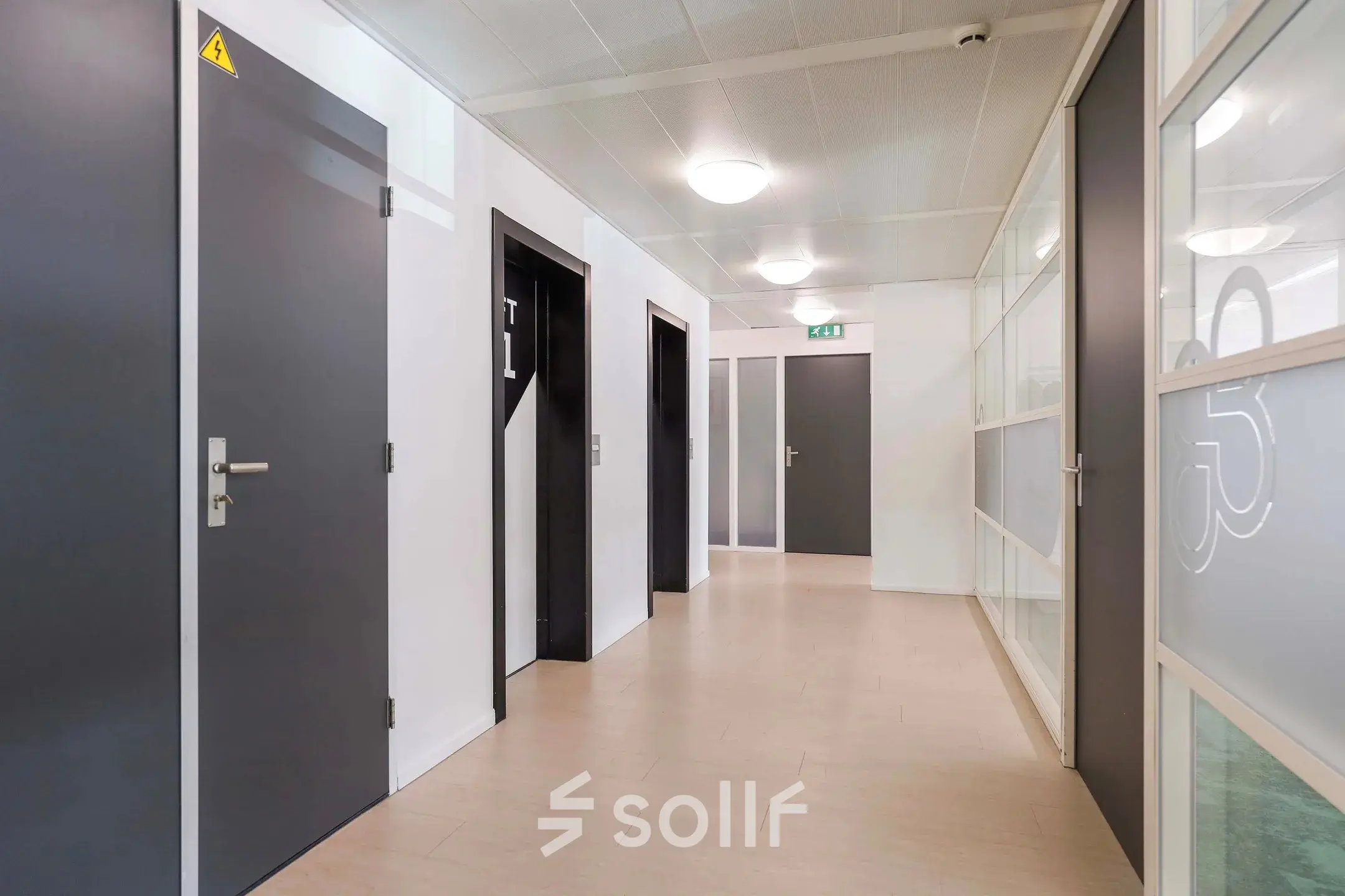 Modern office hallway at Prins Willem-Alexanderlaan 301, Apeldoorn, featuring sleek doors and ample lighting for office space rental.
