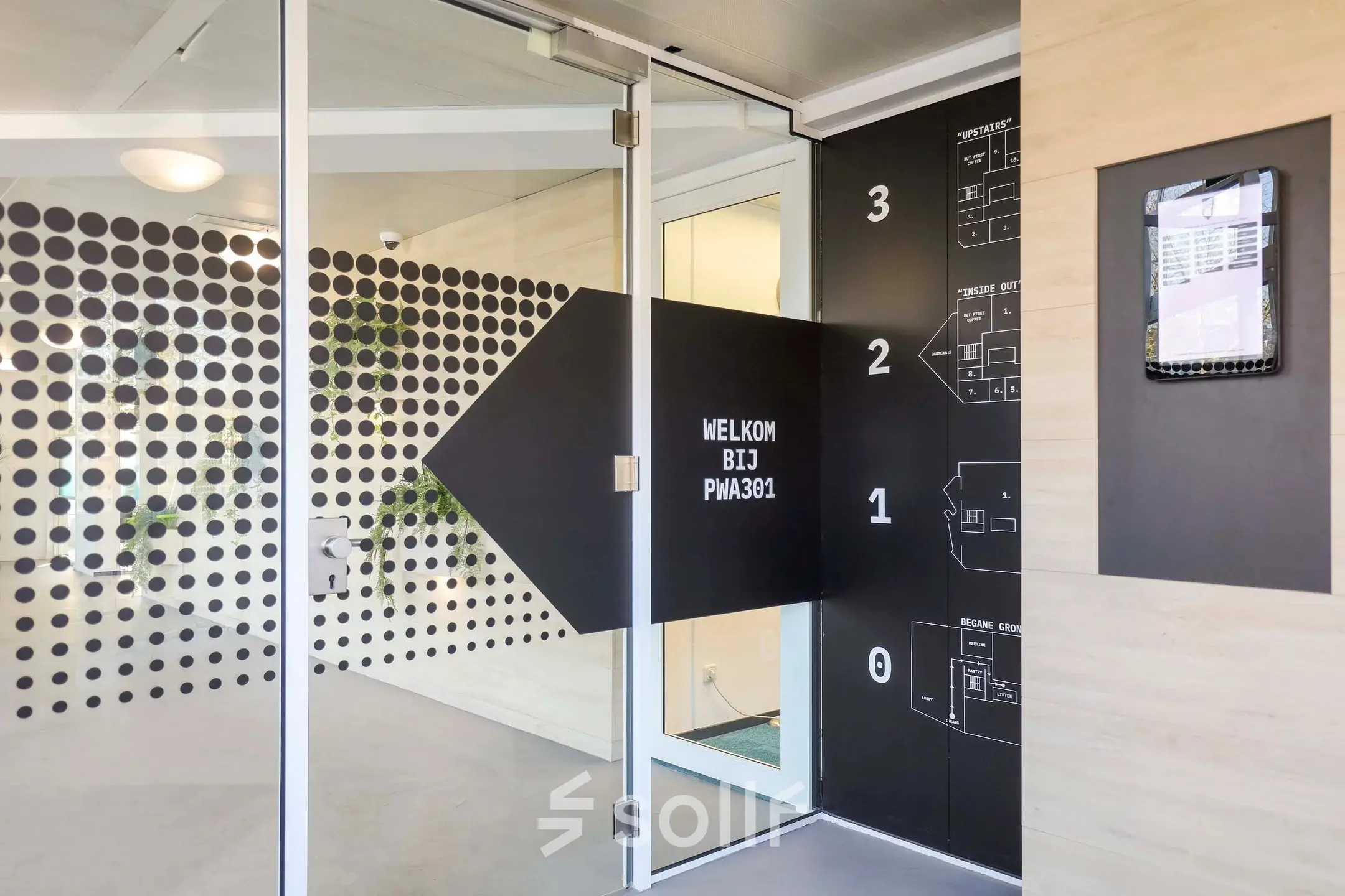 Entrance of an office to rent at Prins Willem-Alexanderlaan 301, Apeldoorn, featuring modern design and directional signage.