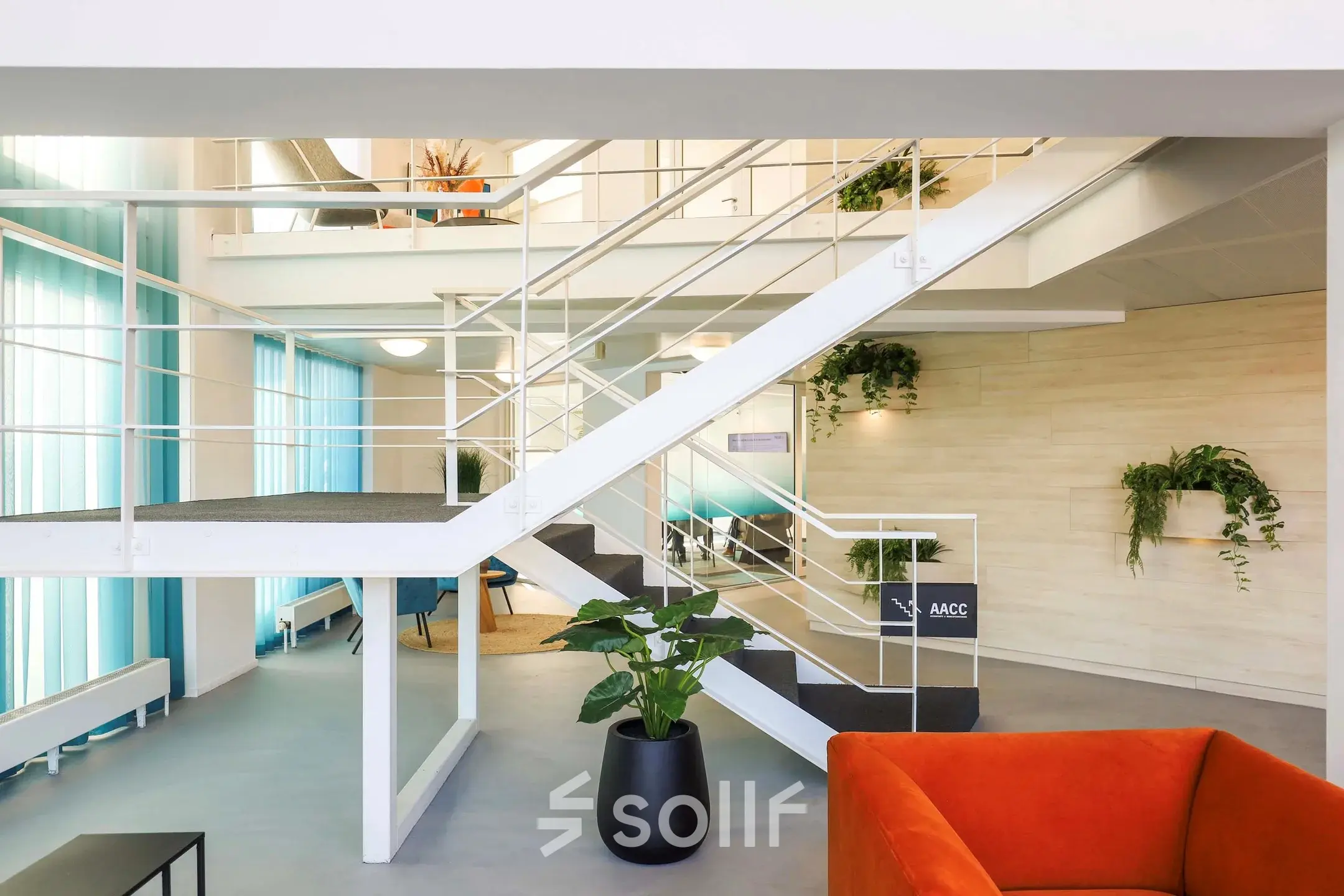 Spacious office area at Prins Willem-Alexanderlaan 301, Apeldoorn, featuring modern design elements and plant accents, ideal for rent office space seekers.