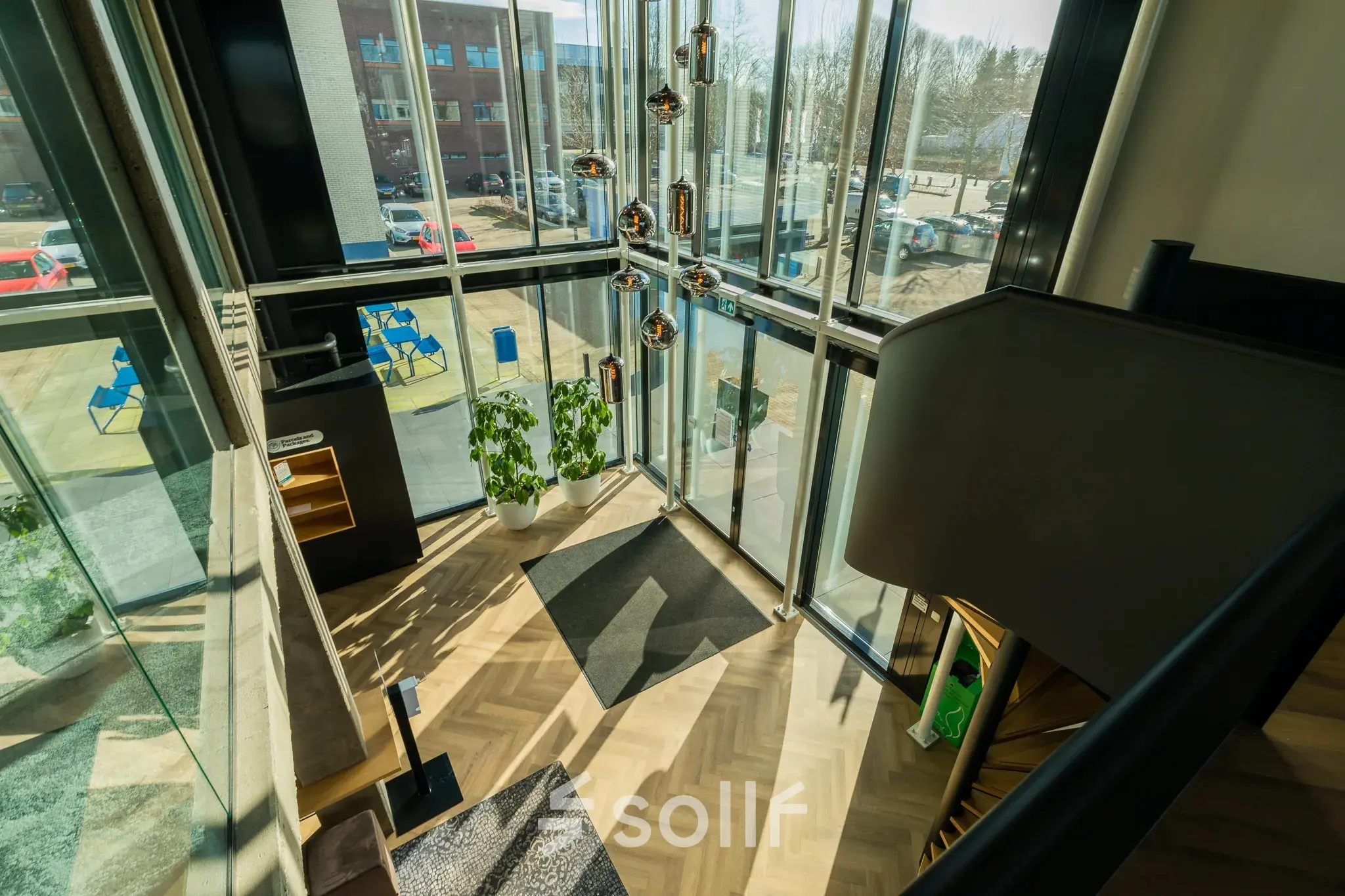 Bright office space with modern furnishings and large windows, located at Prins Willem Alexanderlaan 701, Apeldoorn, ideal for office space rental.