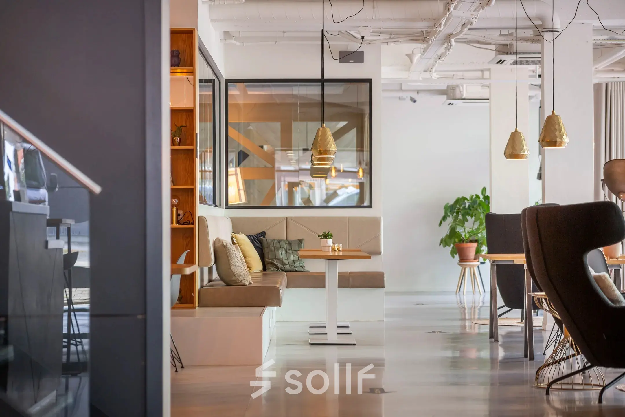 Bright and modern furnished office space on Roggestraat 111, featuring cozy seating areas and stylish decor, perfect for office space rental.