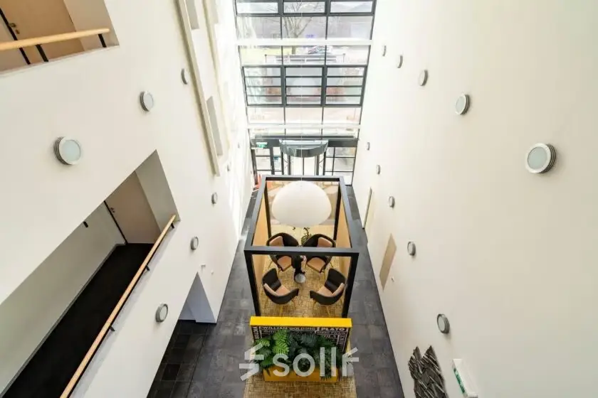 Interior of Schumanpark 9 in Apeldoorn, showcasing a bright, open workspace suitable for office space rental.