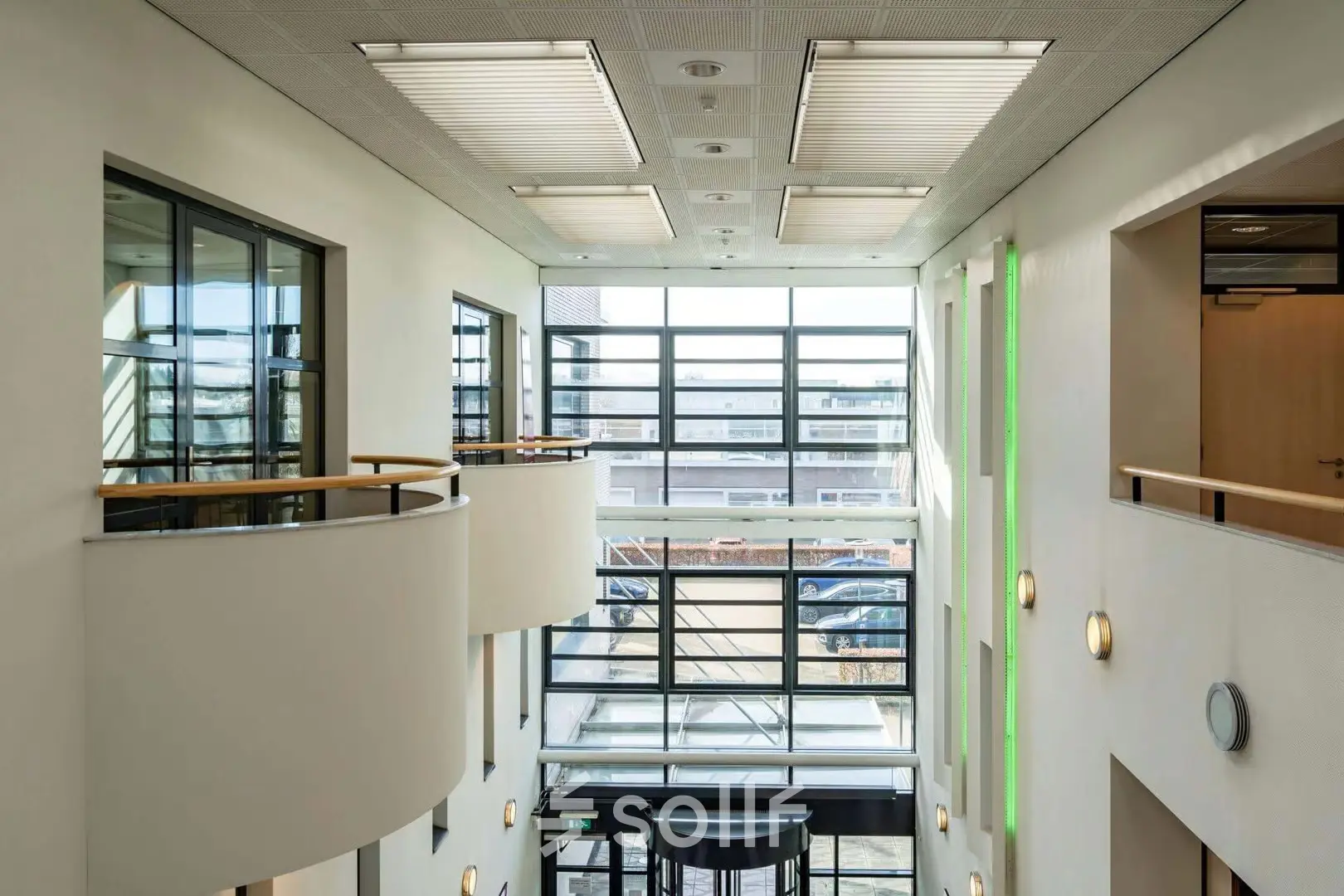 Interior view of Schumanpark 9 in Apeldoorn showcasing natural light filling the office space available for rent.