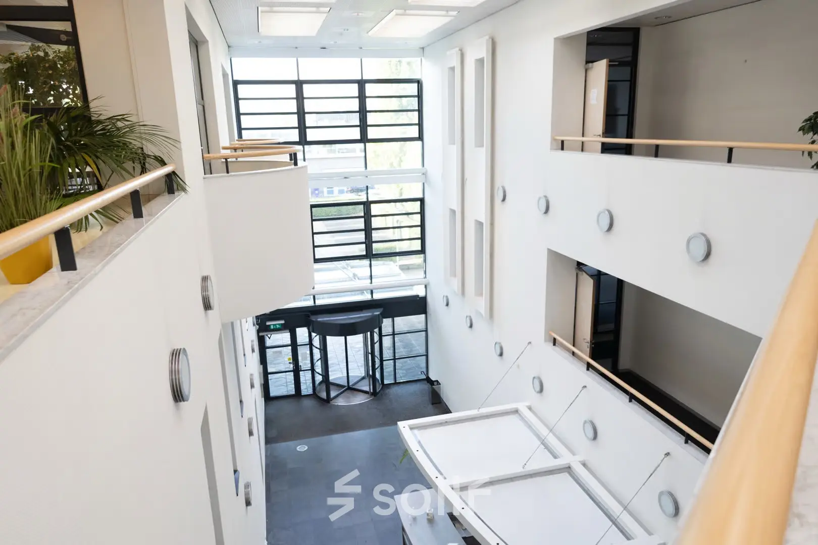 Bright interior of an office space at Schumanpark 9, Apeldoorn, highlighting ample natural light and modern design. Perfect for those seeking office space rental.