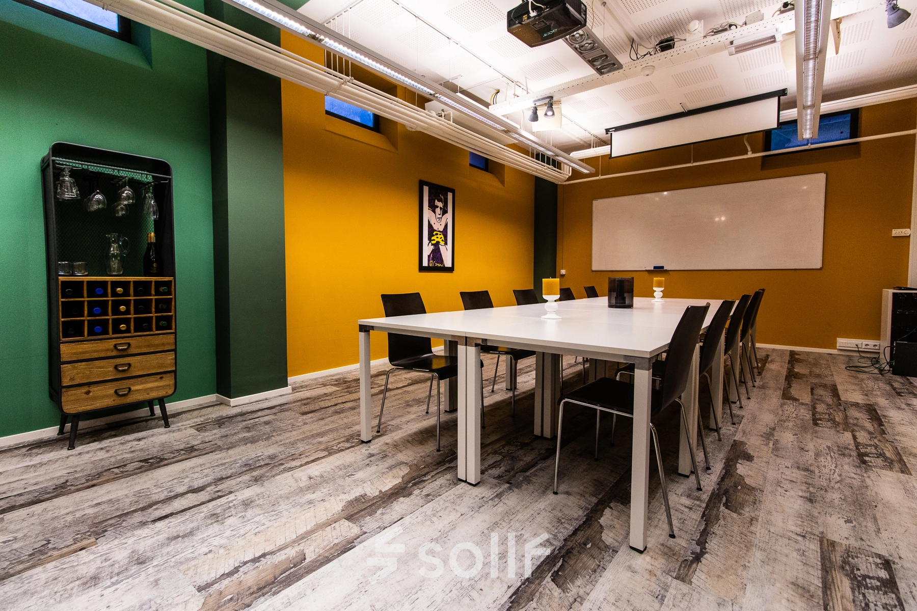 Colorful office to rent at Jansbuitensingel 7, Arnhem Centrum, featuring a spacious conference room with a large table and modern decor for office space rental.