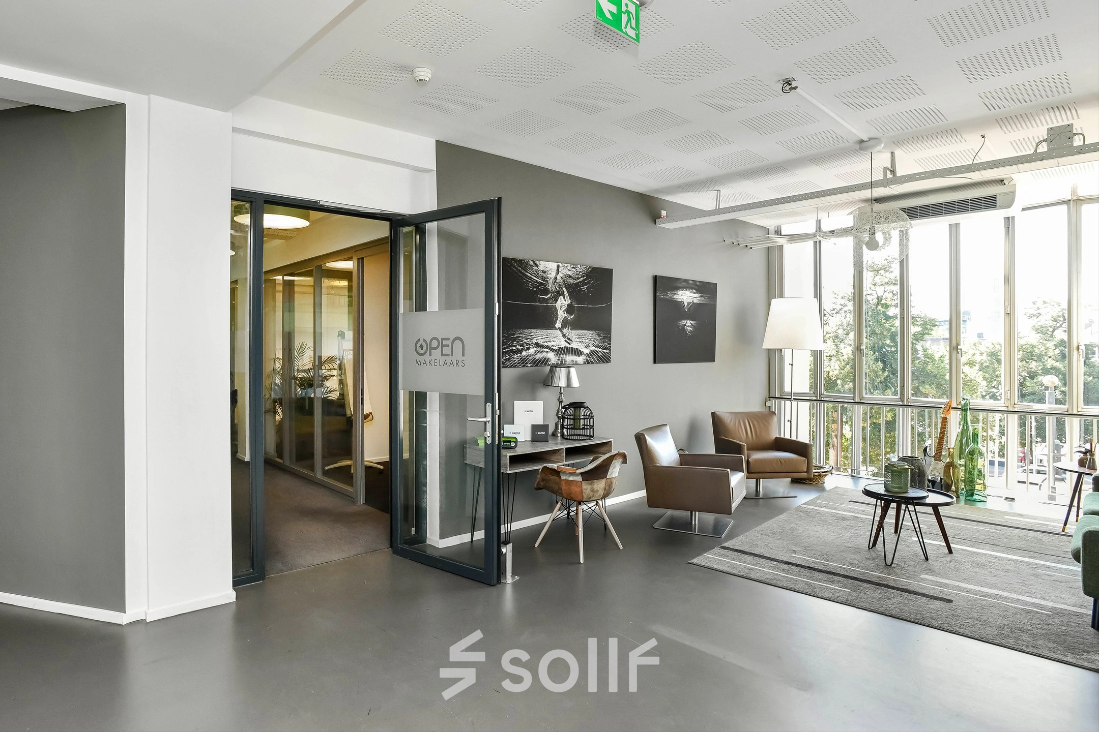 Bright office space with large windows and modern furnishings at Jansbuitensingel 7, perfect for rent office space in Arnhem Centrum.