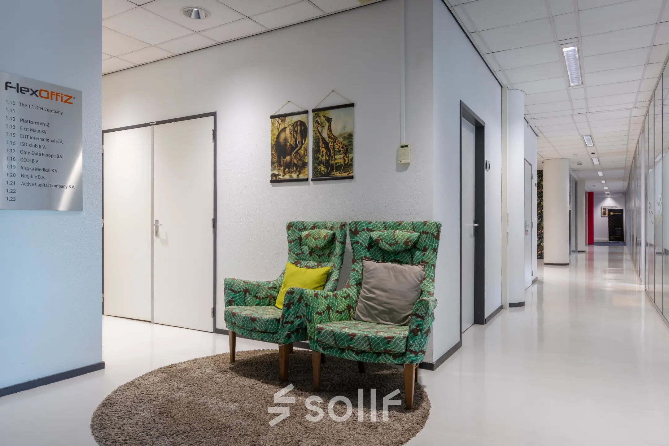 Furnished office interior at Amalialaan 126, Baarn, displaying cozy chairs in a hallway, ideal for rent office space seekers. Subtle decor enhances the atmosphere for office space rental.